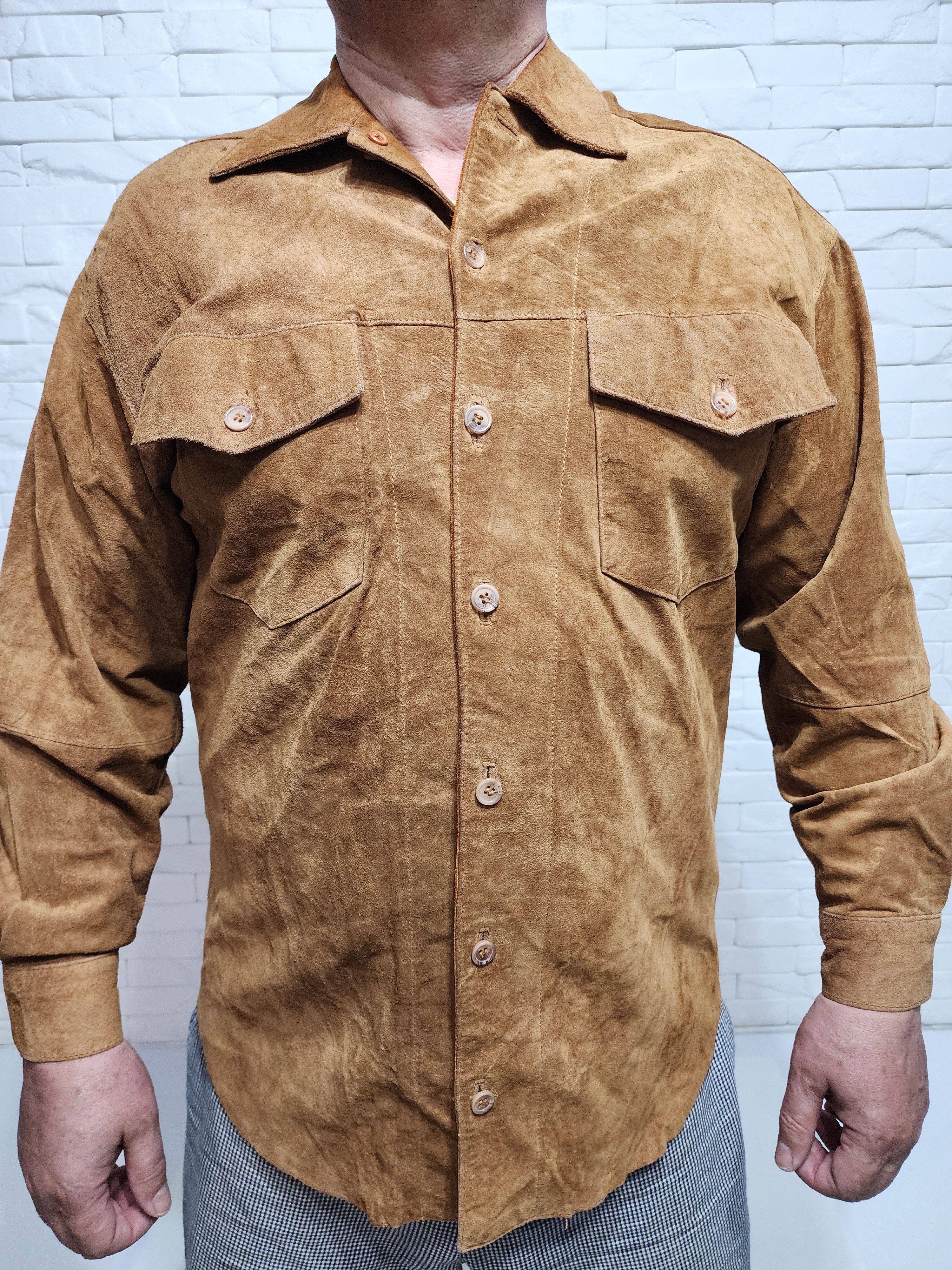 Men's leather shirt with plastic buttons.