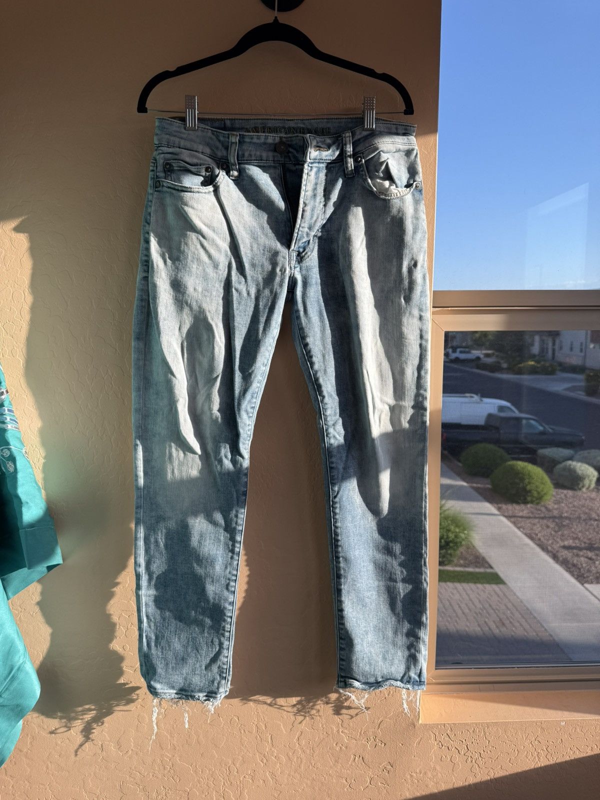 American Eagle Outfitters American Eagle Light Wash Distressed Hem Jeans - Size 29 Size US 29 - 1 Thumbnail