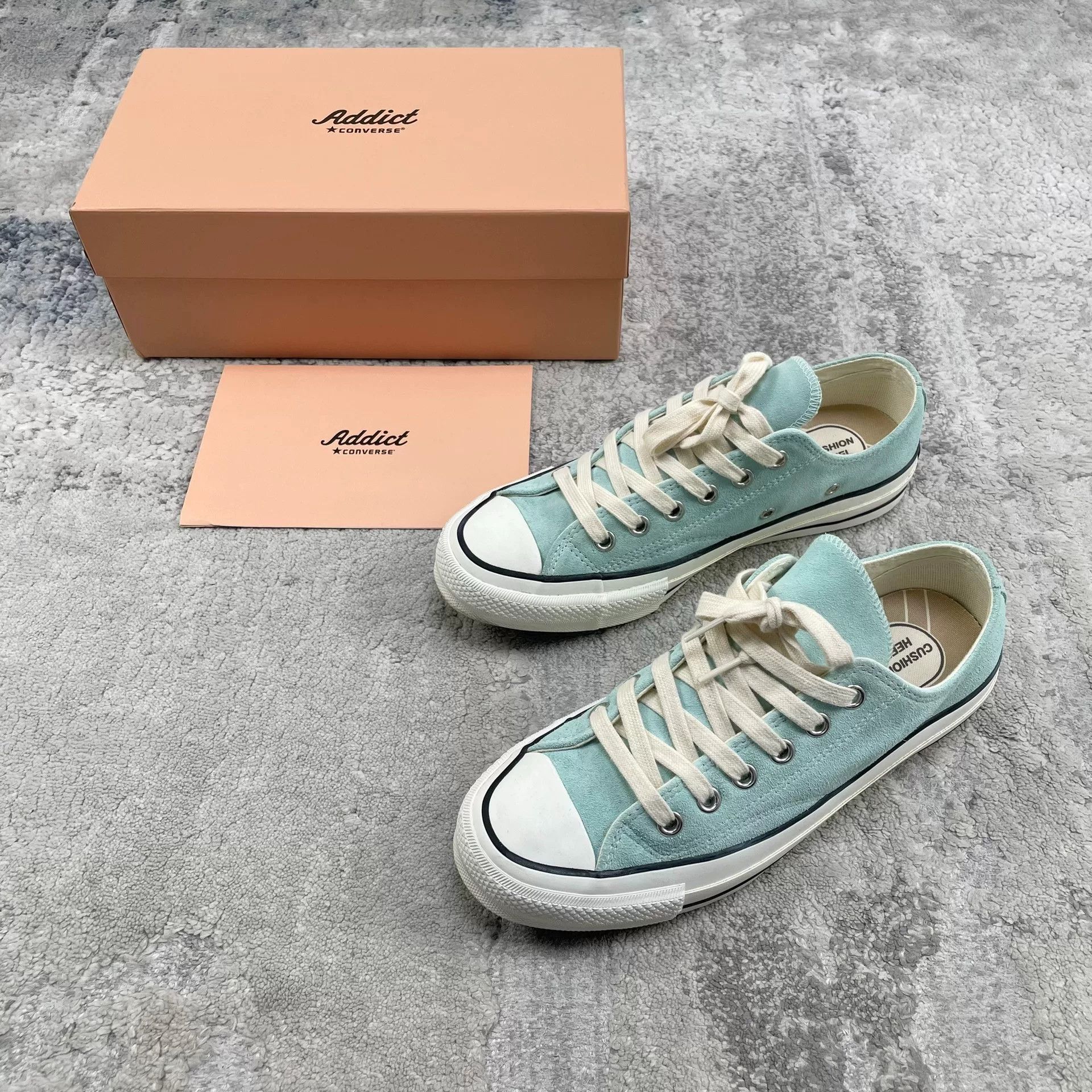 mint green low-top canvas sneakers