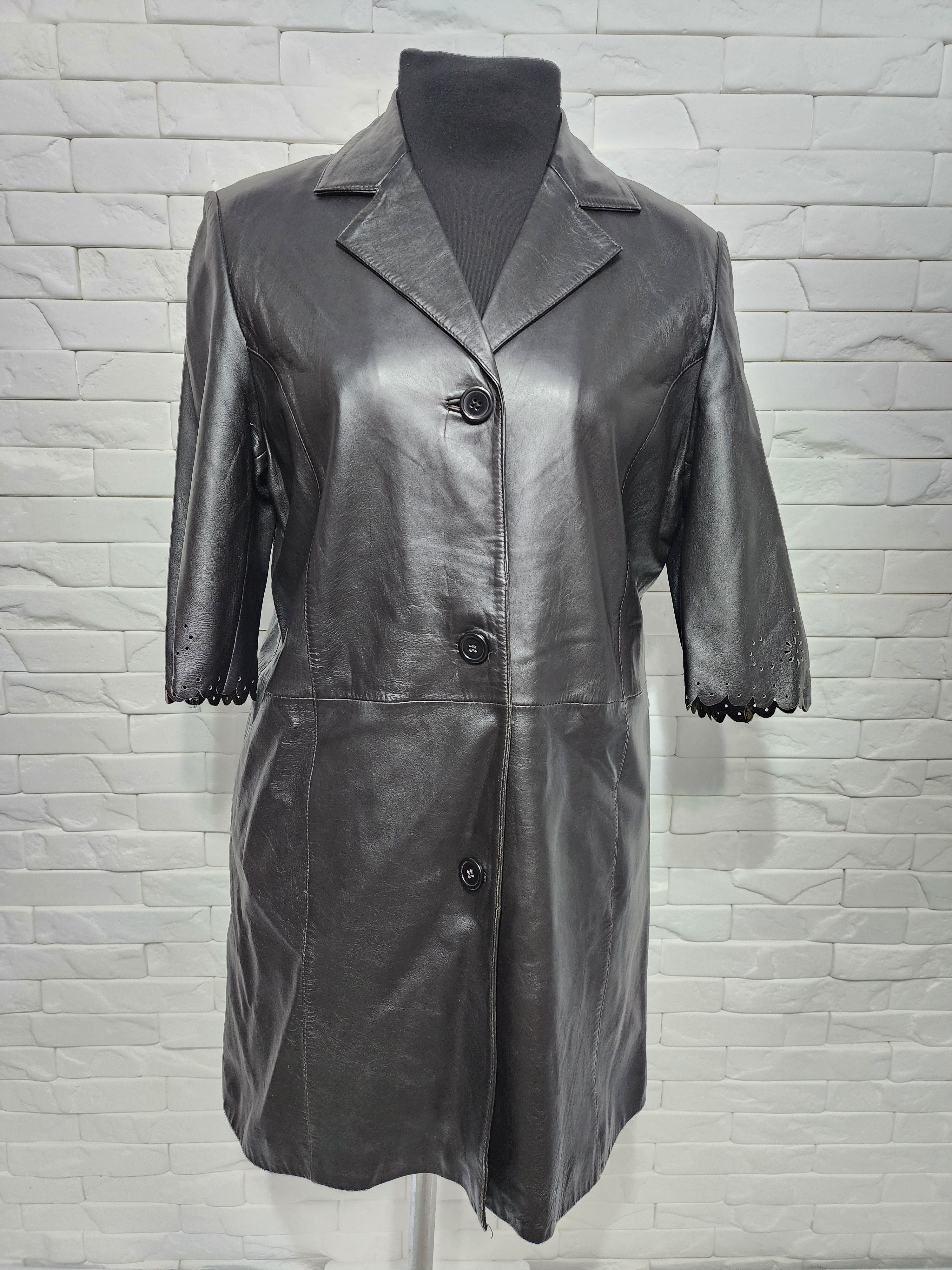 Stylish long women's leather jacket.