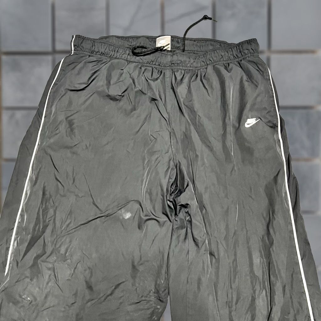 Nike VINTAGE 90s Nike Track Pants Mens XXL Black Cuffed Windbreaker Swoosh Ankle Zip Pants Mens Black 90s Nike Track Windsuit? Size 48R - 1 Thumbnail