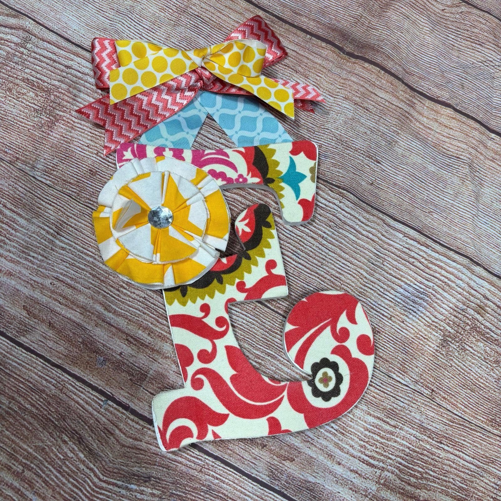 Other Colorful Fabric 'E' Wall Decor with Bow and Flower Accents Size ONE SIZE - 1 Thumbnail