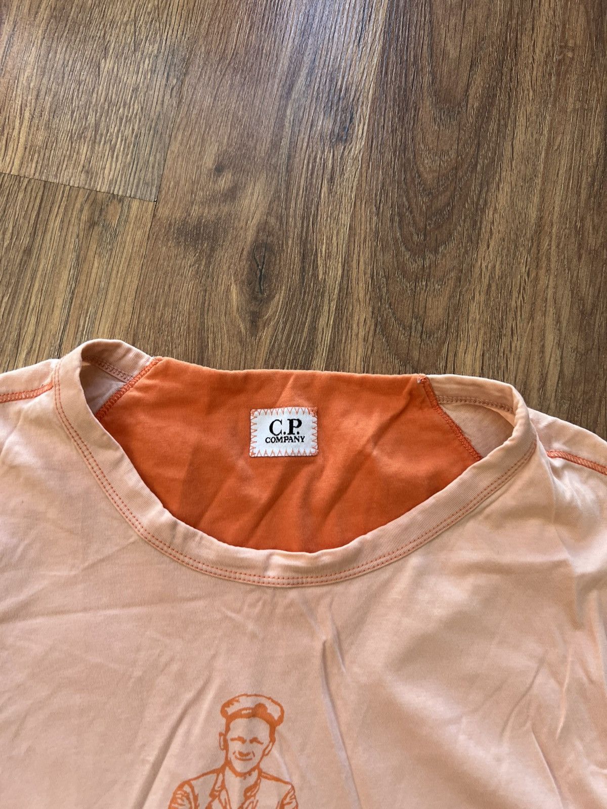 C.P. Company C.P. Company Graphic Logo T-Shirt — Light Peach / Size M Size US M / EU 48-50 / 2 - 5 Thumbnail