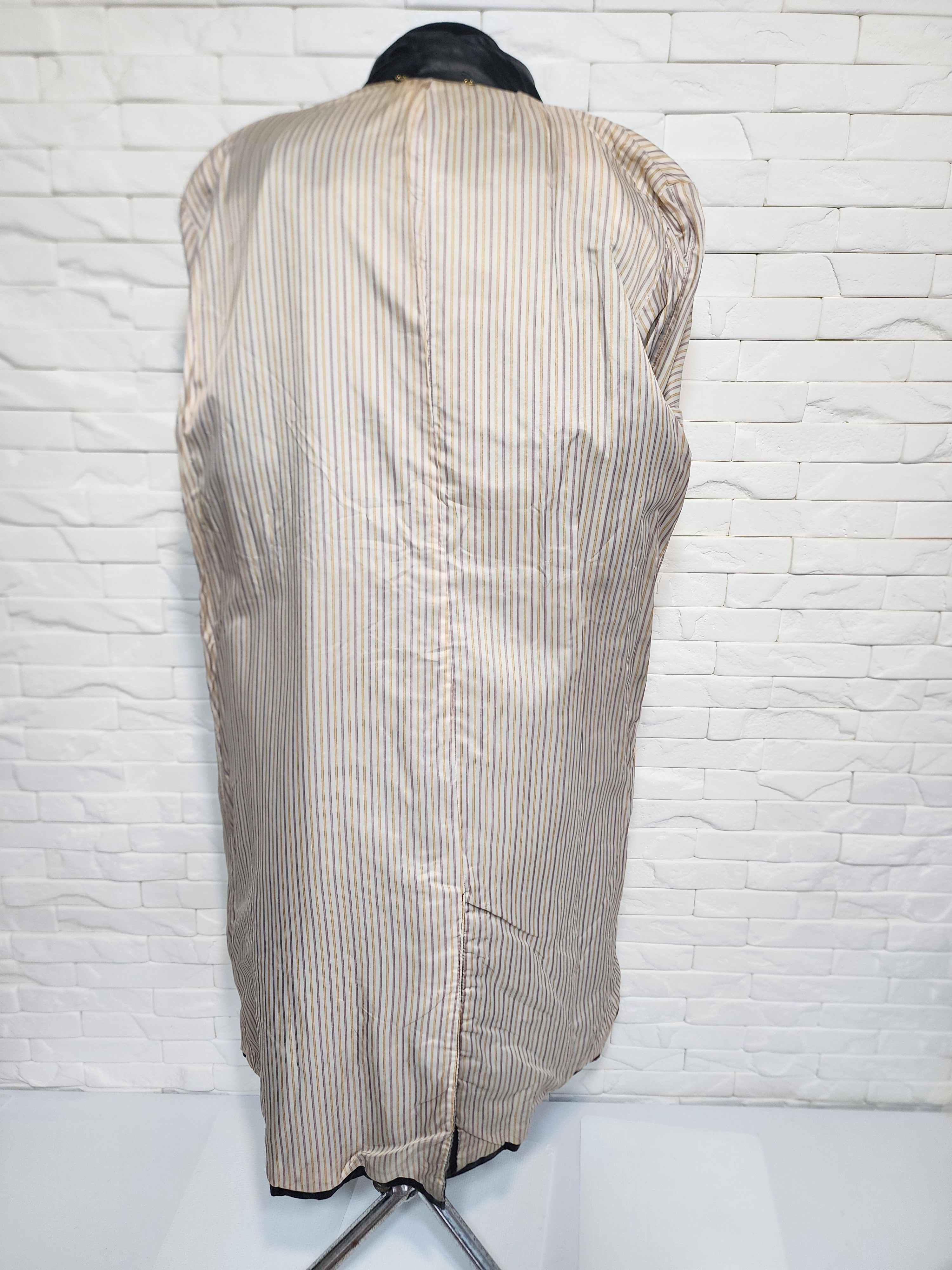 Women black leather raincoat.