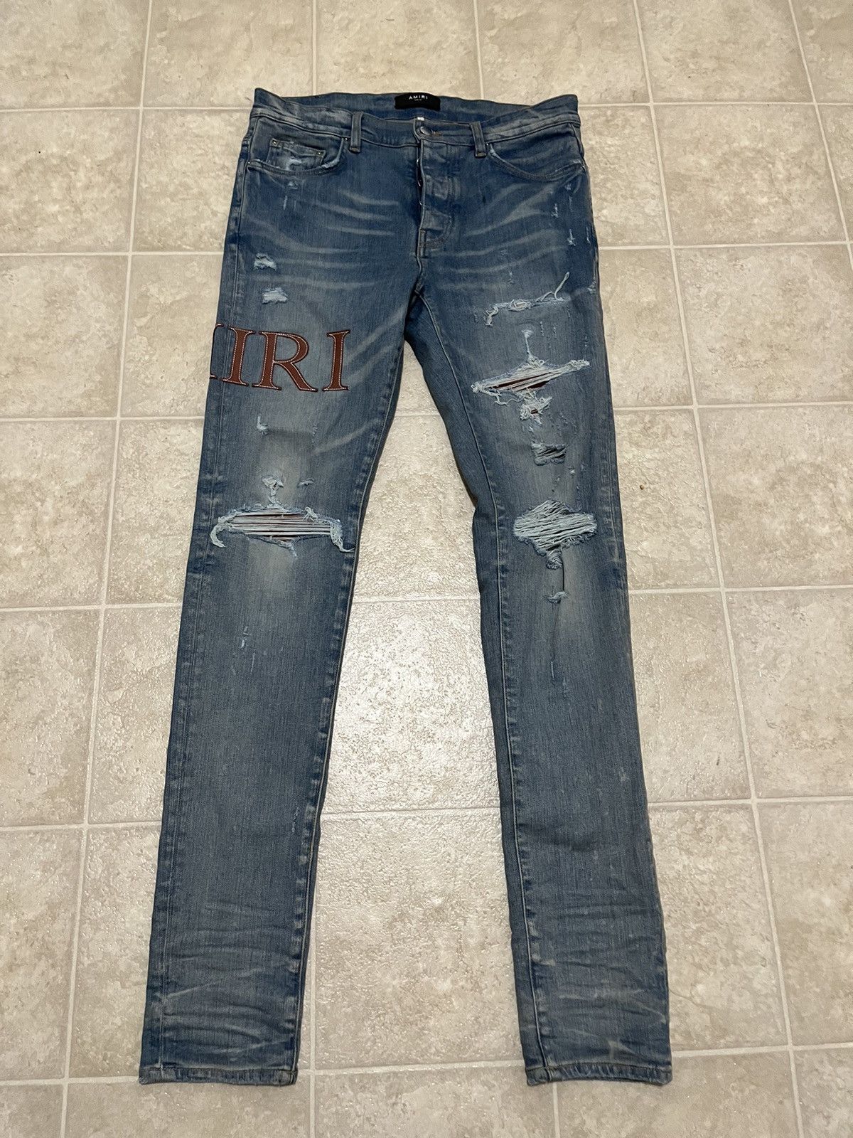 Amiri Amiri Leather Stitch Logo Clay Indigo Jeans | Grailed