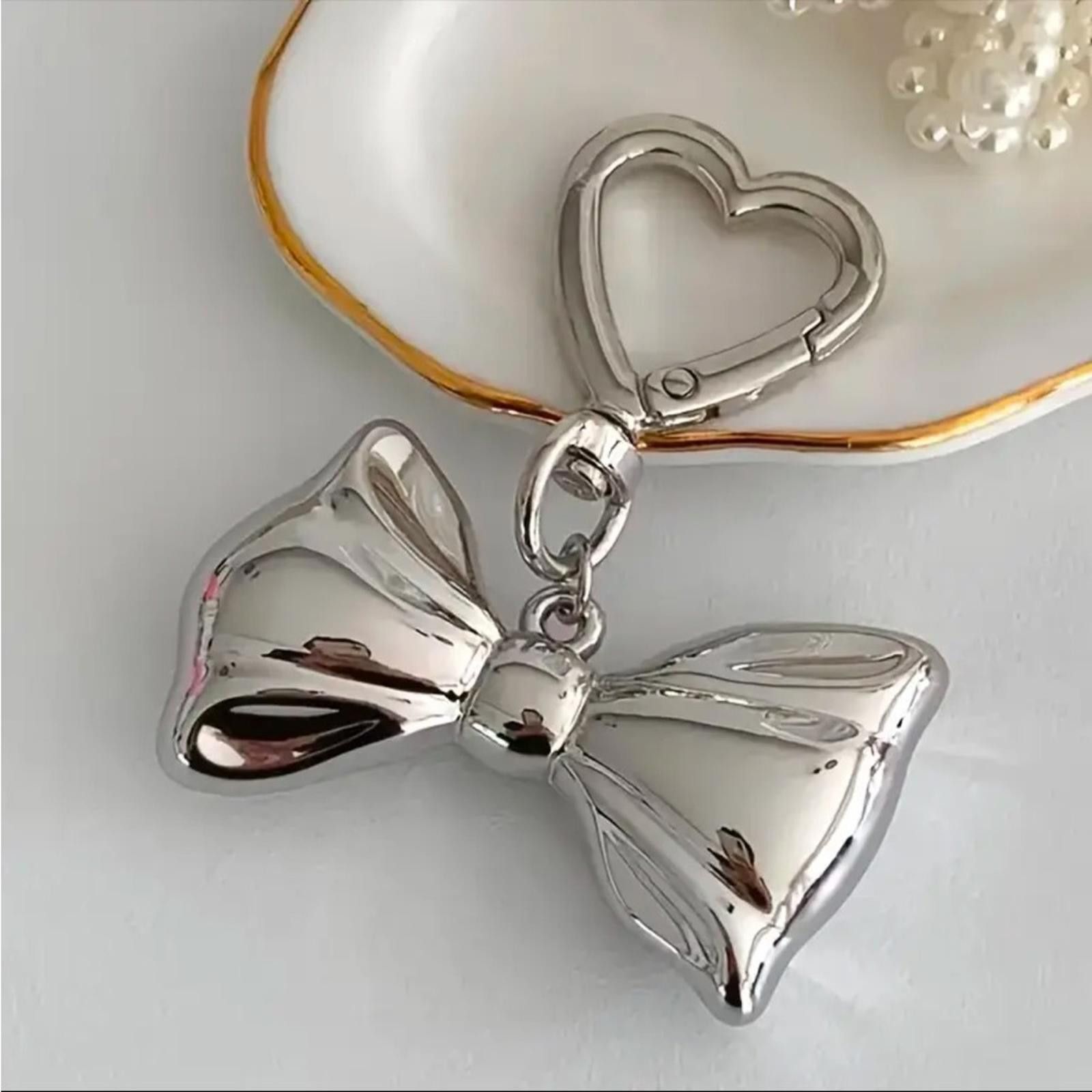 Designer Silver Bow Dainty Keychain Bag Charm Size ONE SIZE - 1 Thumbnail