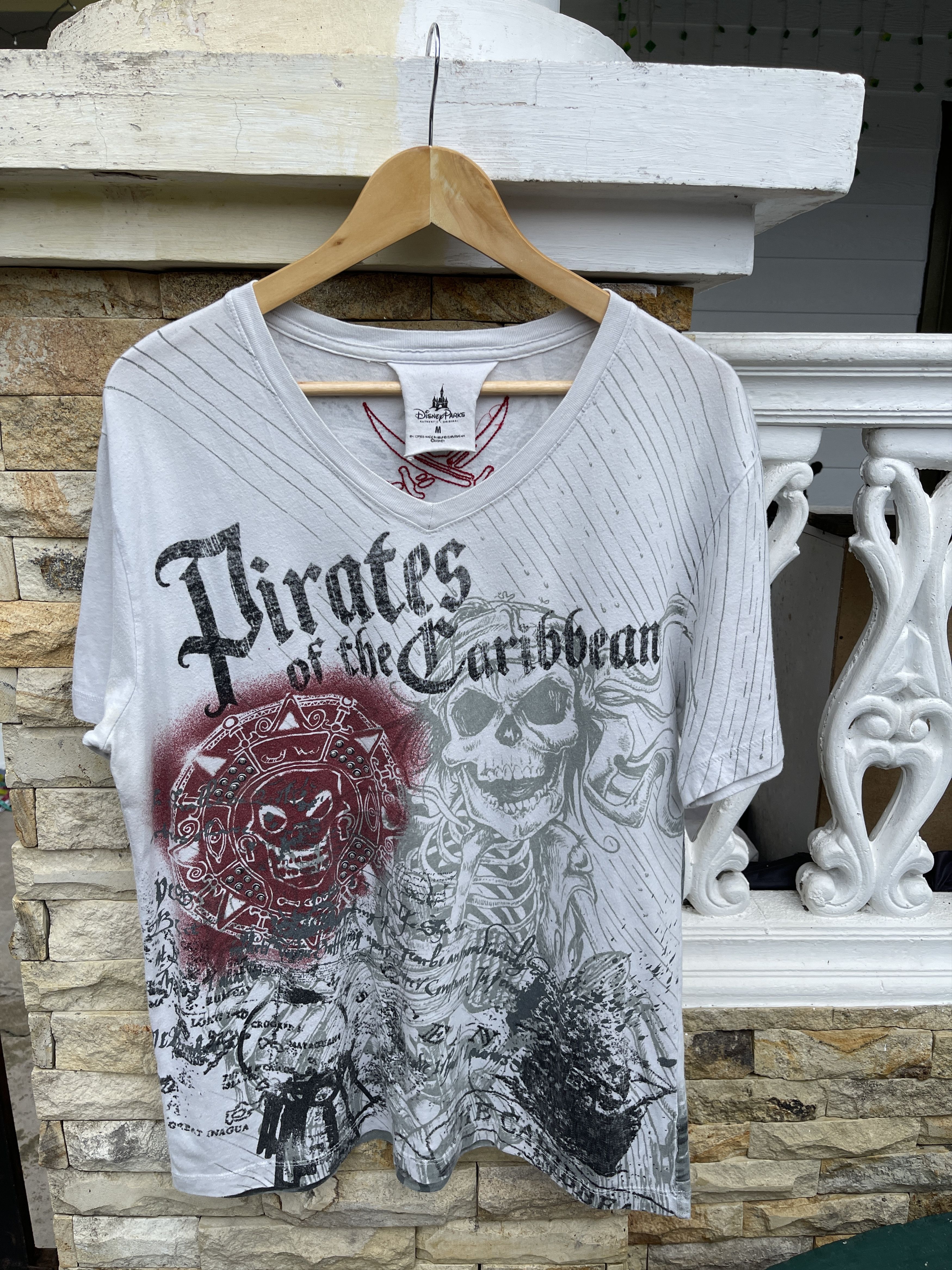 image of vintage Disney Pirates Of Caribbean T Shirt in White, Men's (Size Medium)