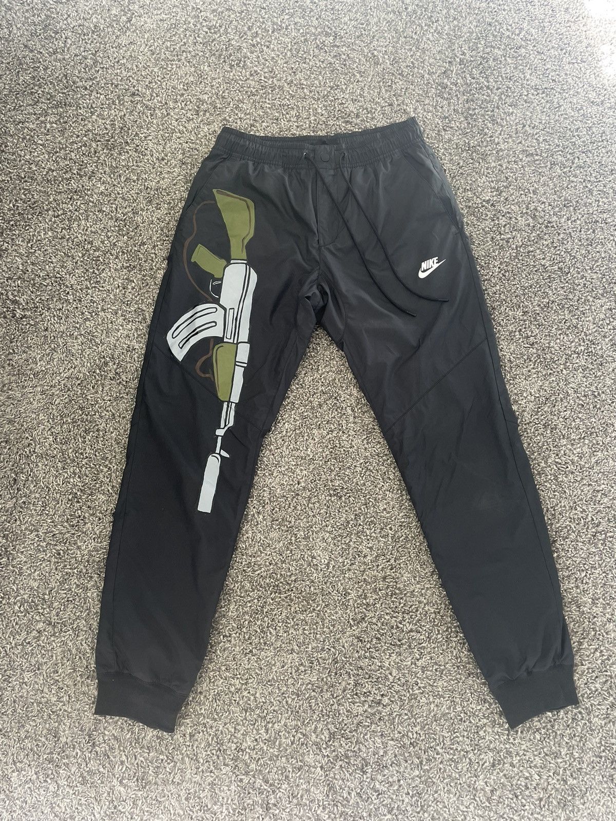 image of Nike Sportswear Windbreaker Pants in Black, Men's (Size 30)