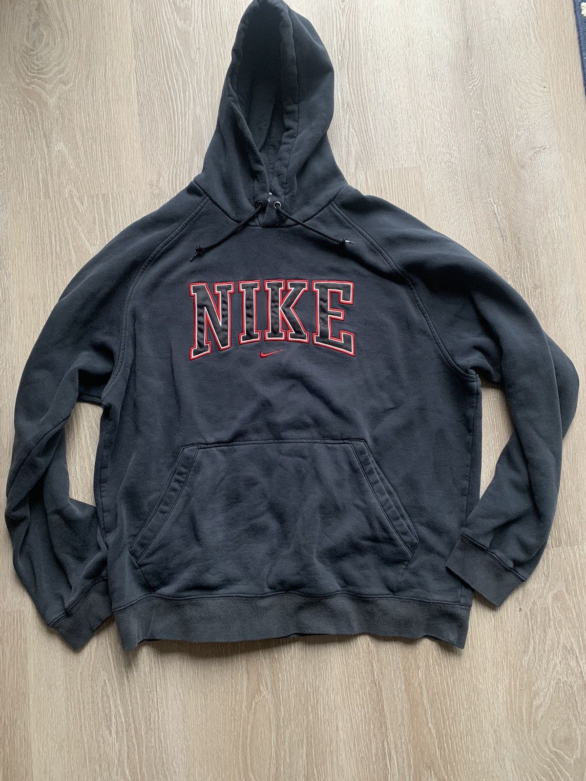 image of Nike Spellout Center Swoosh Hoodie in Black, Men's (Size Large)