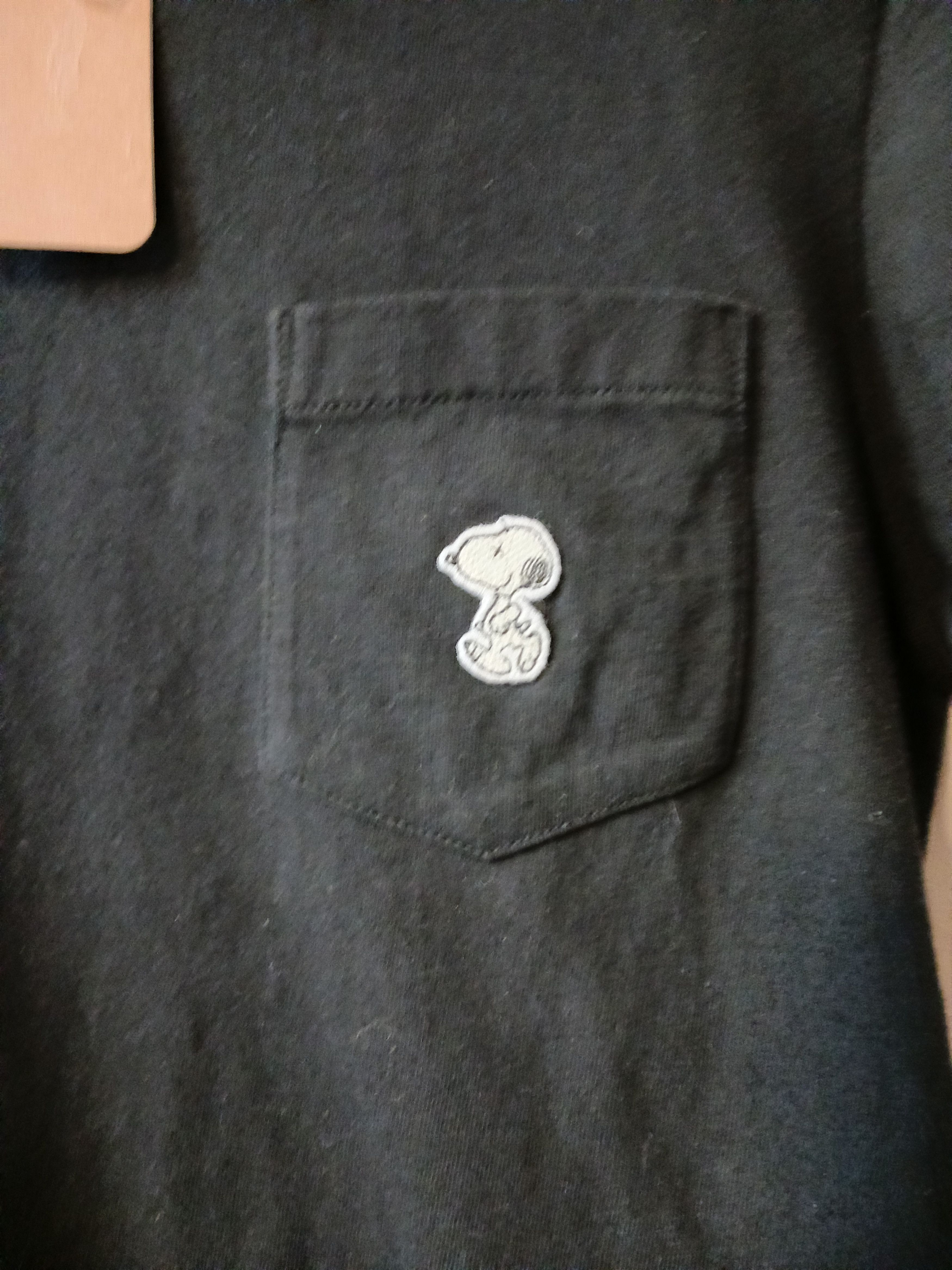 Kaws × Peanuts KAWS x Peanuts "Joe Kaws" Embroidered Pocket Tee Black -XS Size US XS / EU 42 / 0 - 4 Thumbnail