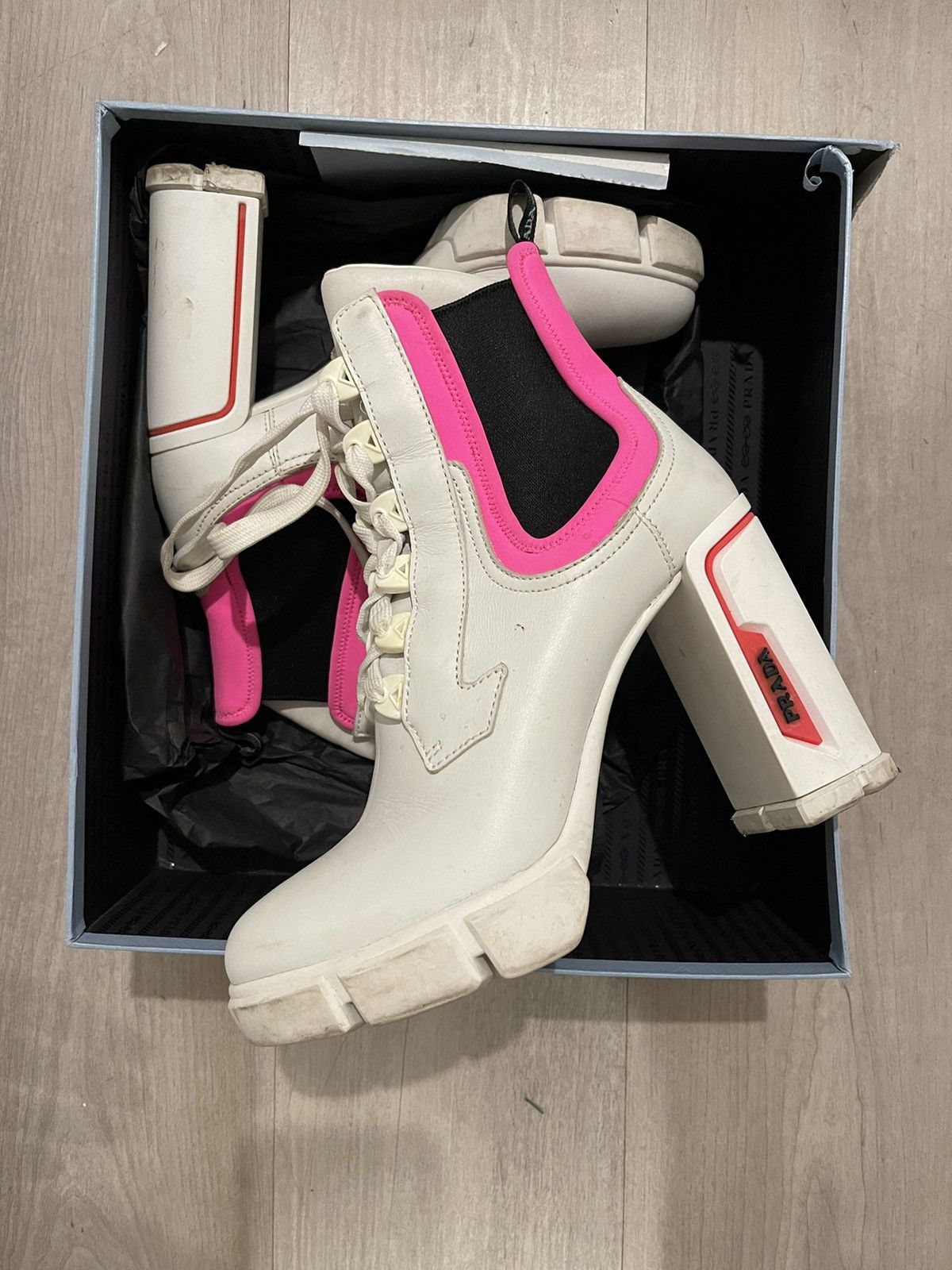 Pink and white prada boots online