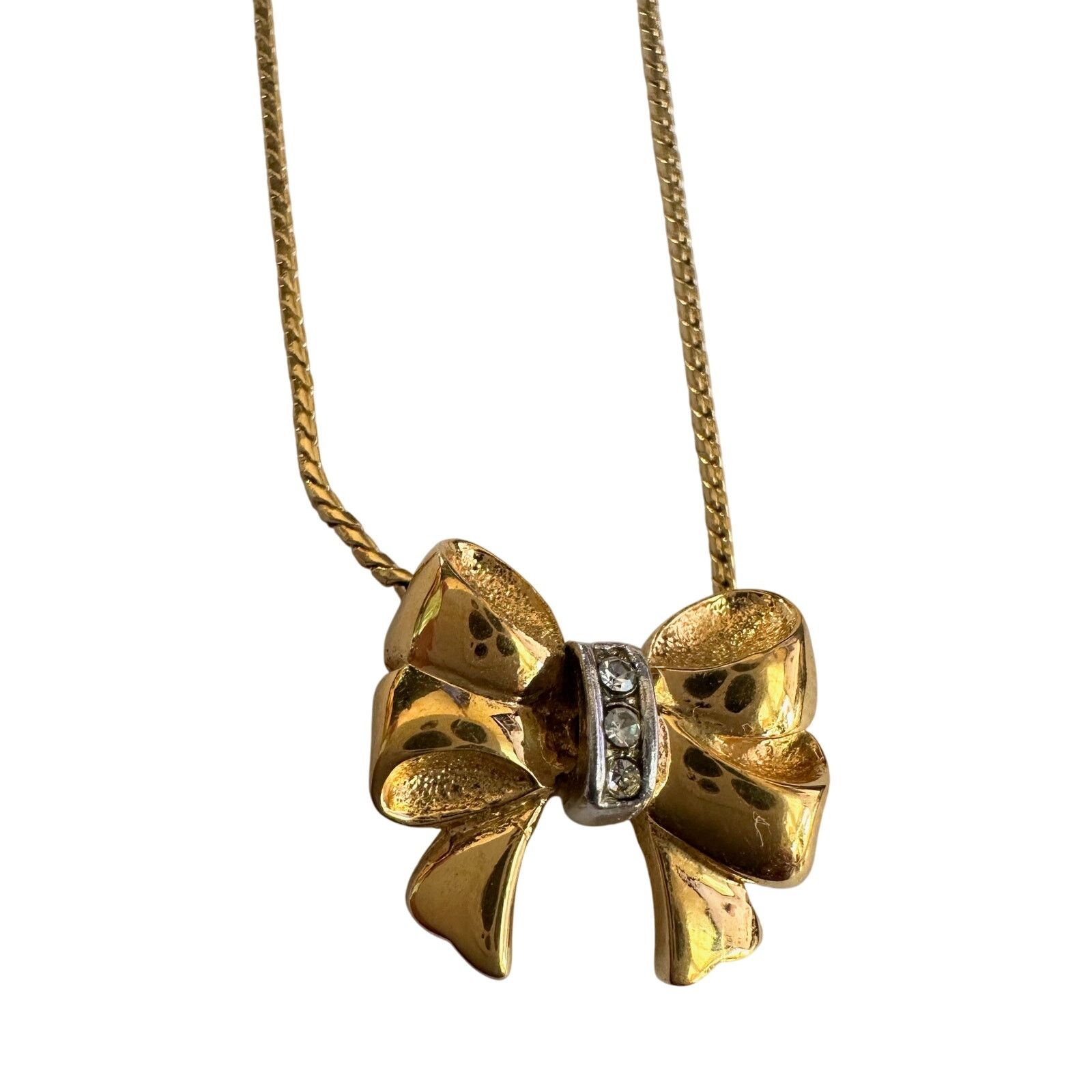Yves Saint Laurent Yves Saint Laurent Gold and Rhinestone Bow Necklace Size ONE SIZE - 13 Thumbnail