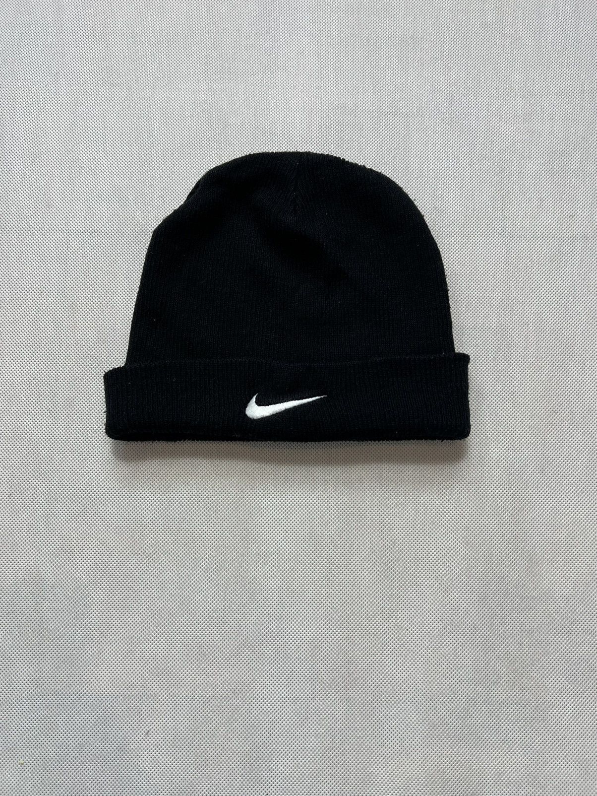 white nike hat with black swoosh