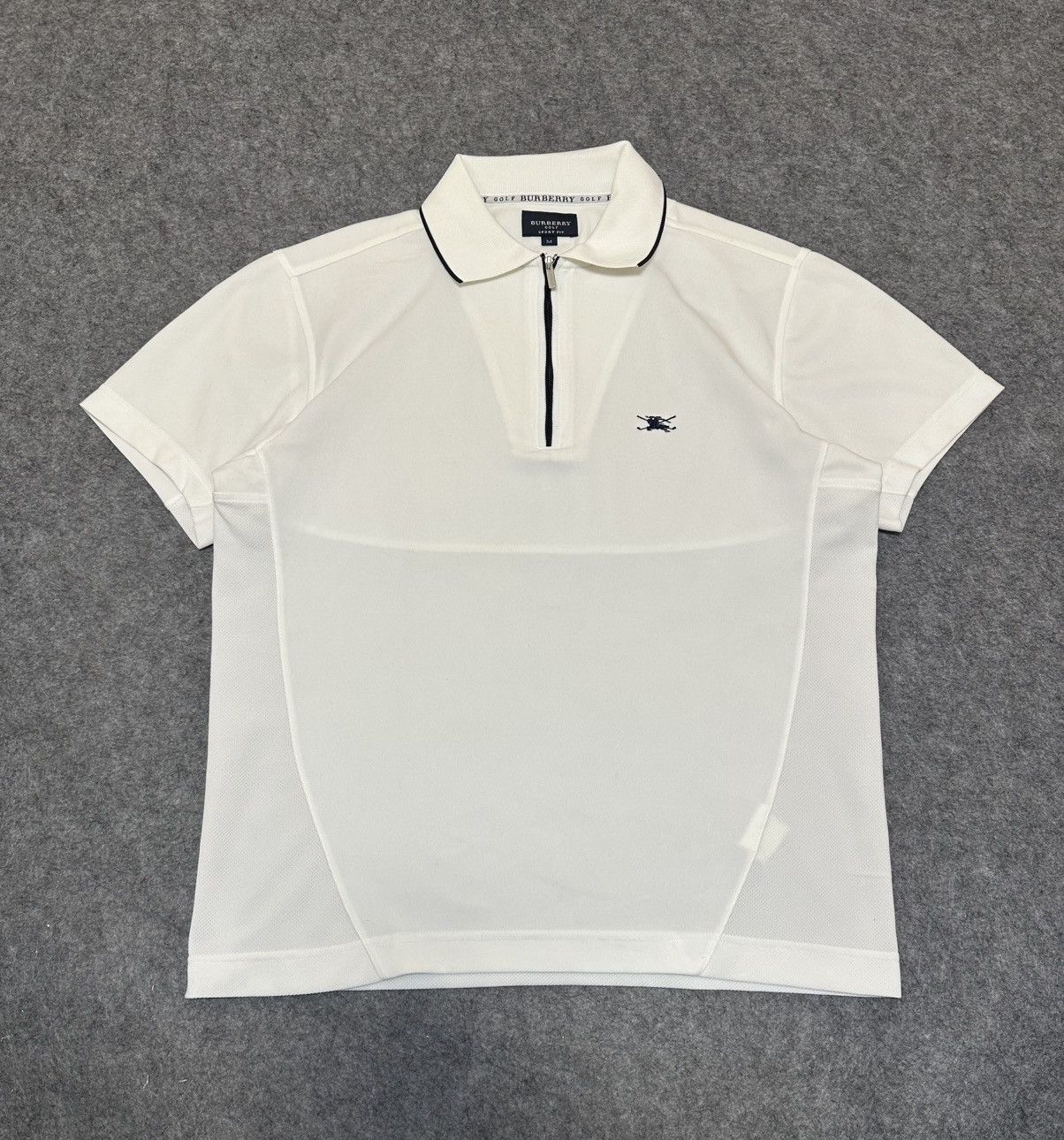 Burberry golf polo shirt featuring a quarter-zip .