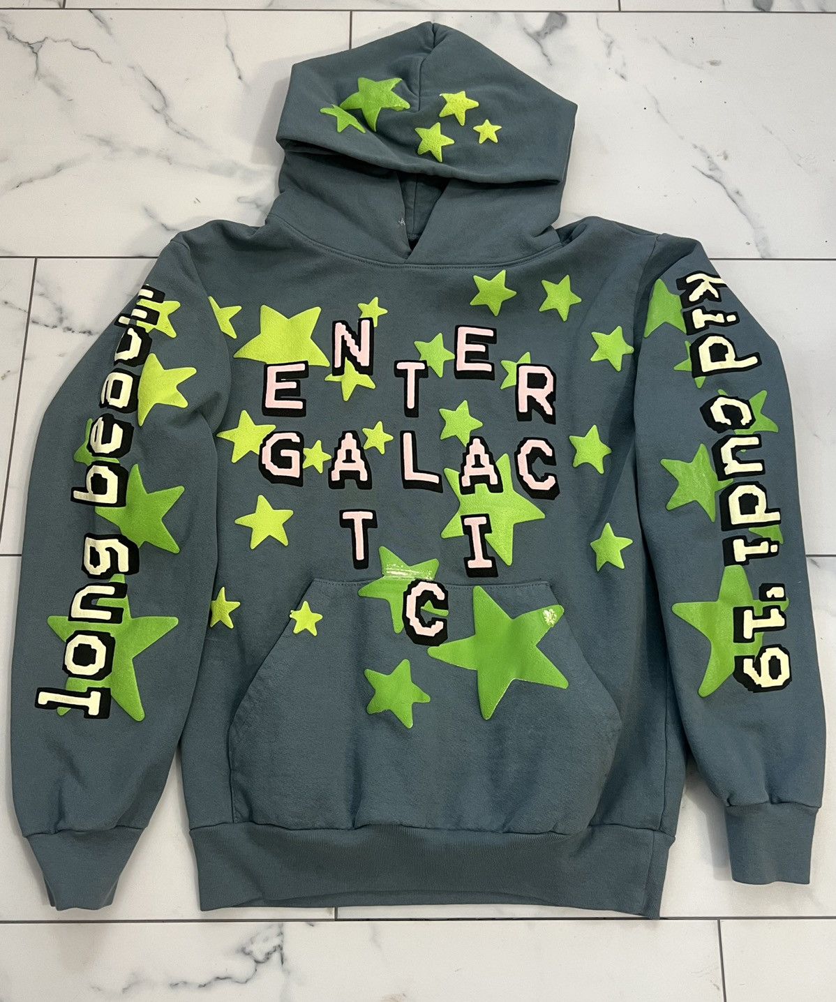 image of Cactus Plant Flea Market x Kid Cudi “Entergalactic” Hoodie in Turquoise (Size Small)