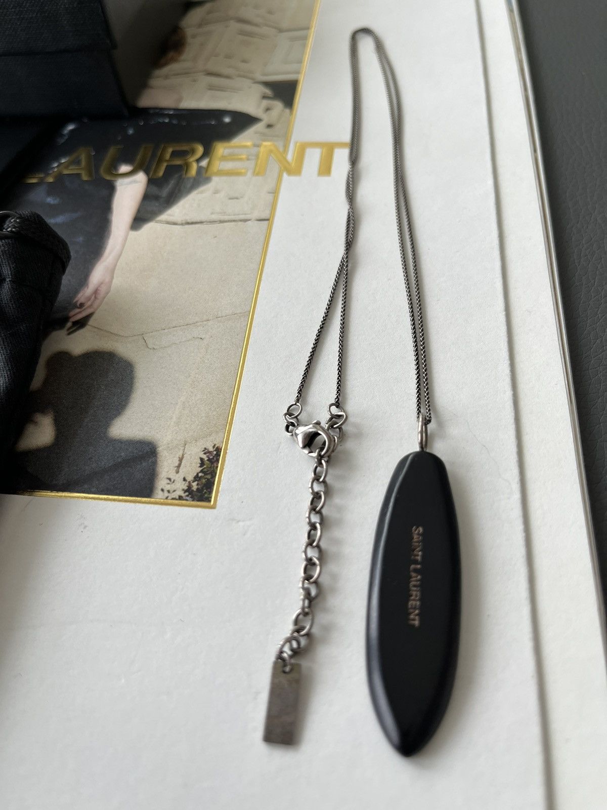 Hedi Slimane × Saint Laurent Paris × Yves Saint Laurent Super Rare Limited Saint Laurent Logo Surf Feather Necklace Size ONE SIZE - 1 Thumbnail