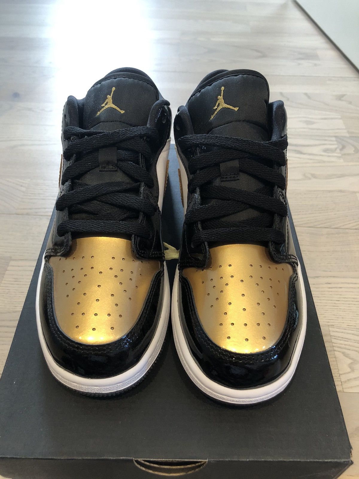 image of Nike Air Jordan 1 Low Shoes in Black, Women's (Size 7.5)
