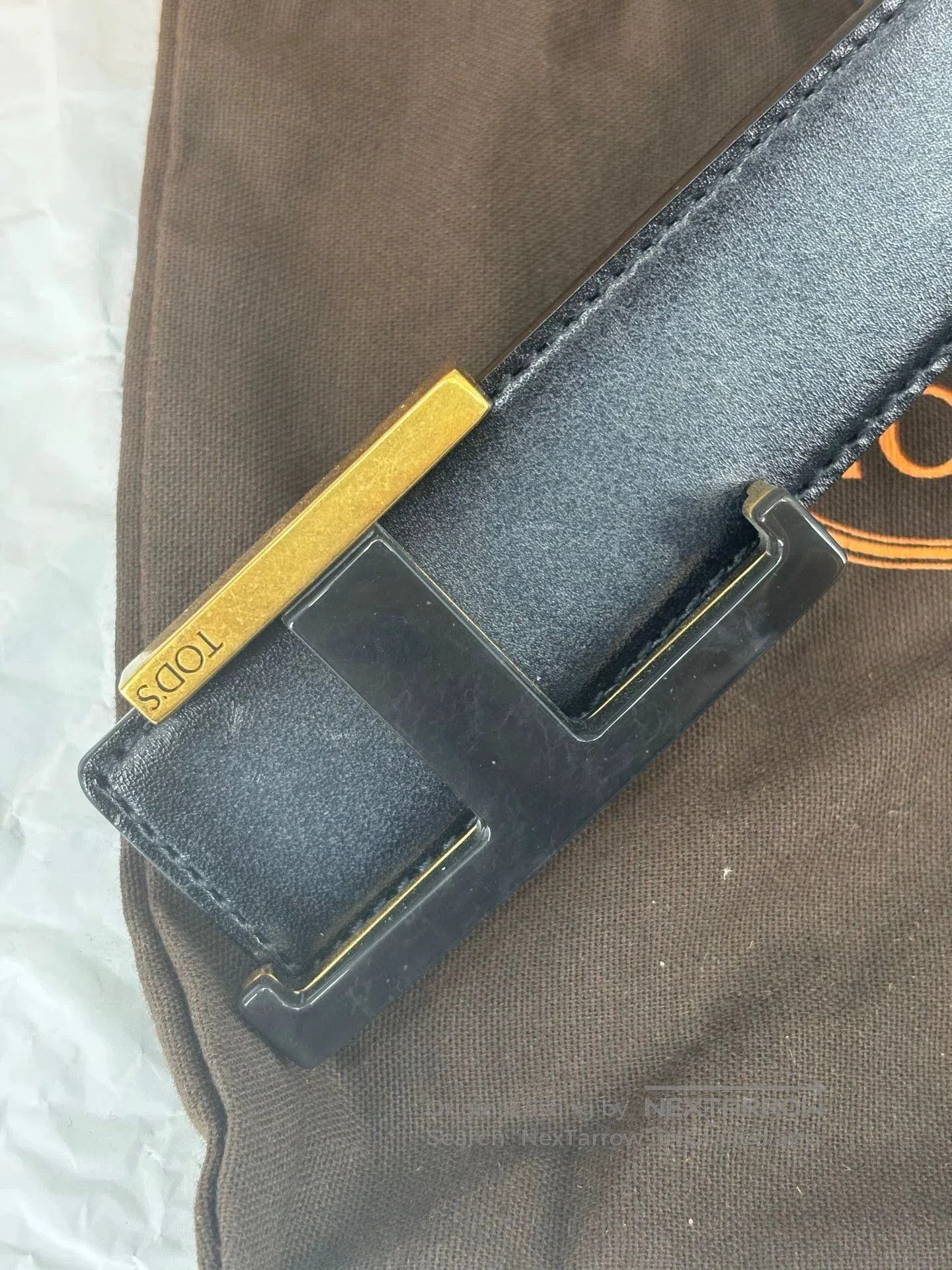 Tod's Black Leather Belt with Gold Logo.