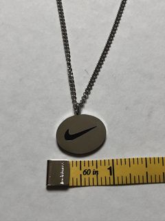 NIKE. Gold Swoosh Pendant Necklace in 2023