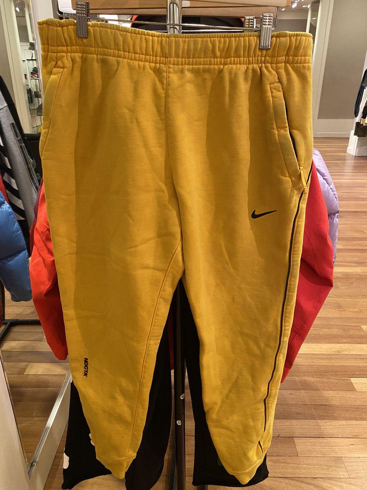 image of Nike Nocta Yellow Sweats, Men's (Size 34)