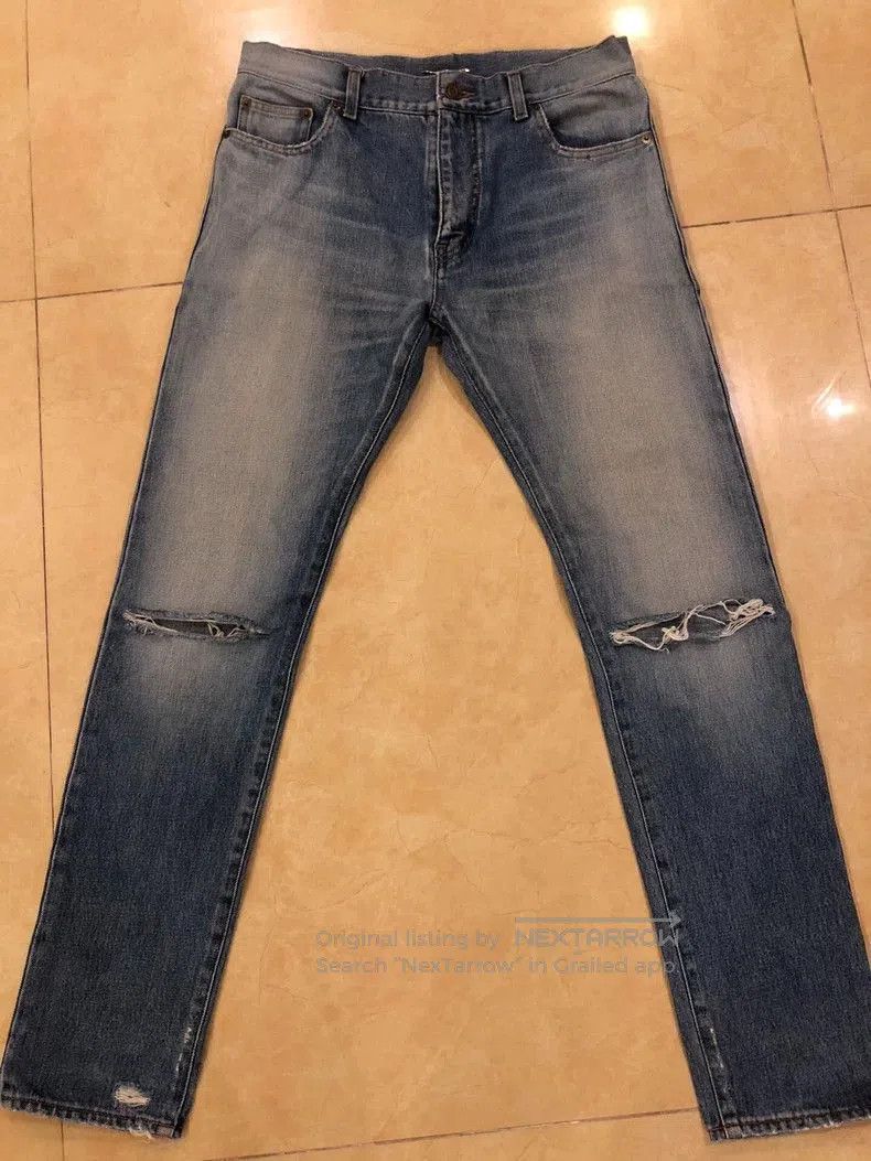 Saint Laurent Blue Knee-Ripped Jeans.
