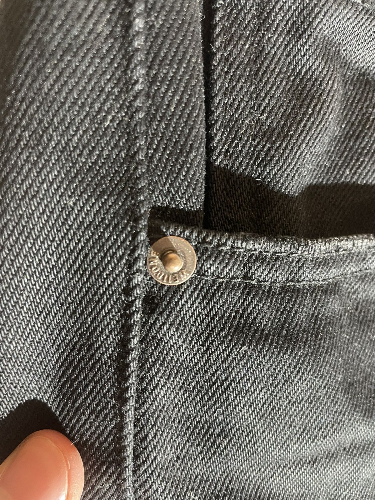 WE11DONE black distressed jeans