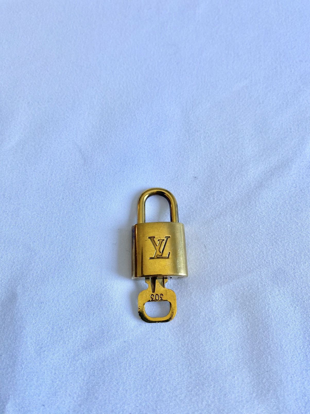 Louis Vuitton, Accessories, Authentic Louis Vuitton Lv Set Padlock Key  Bag Charm Cadena Gold Plated