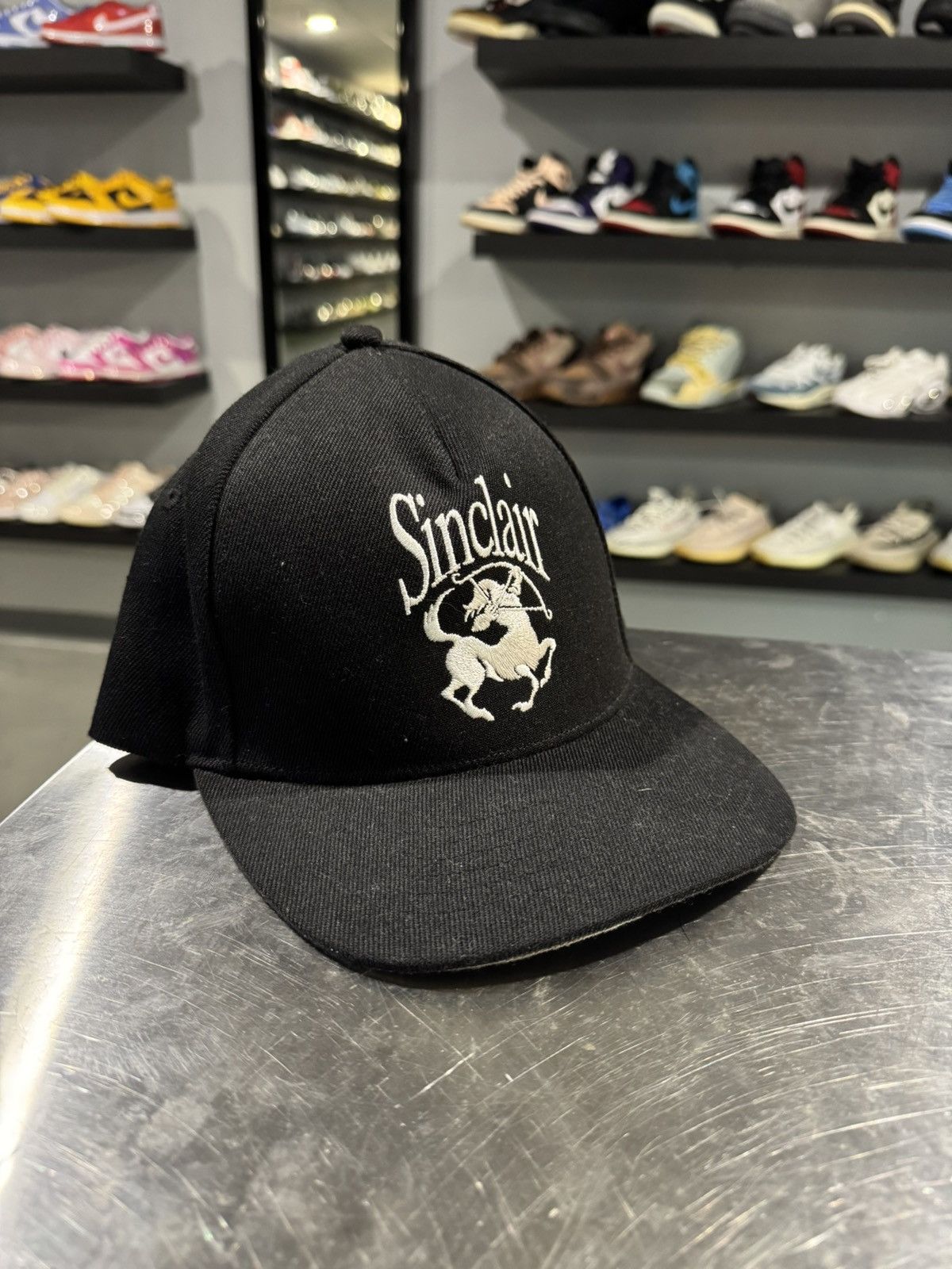 Sinclair Global Escargot Trucker Hat