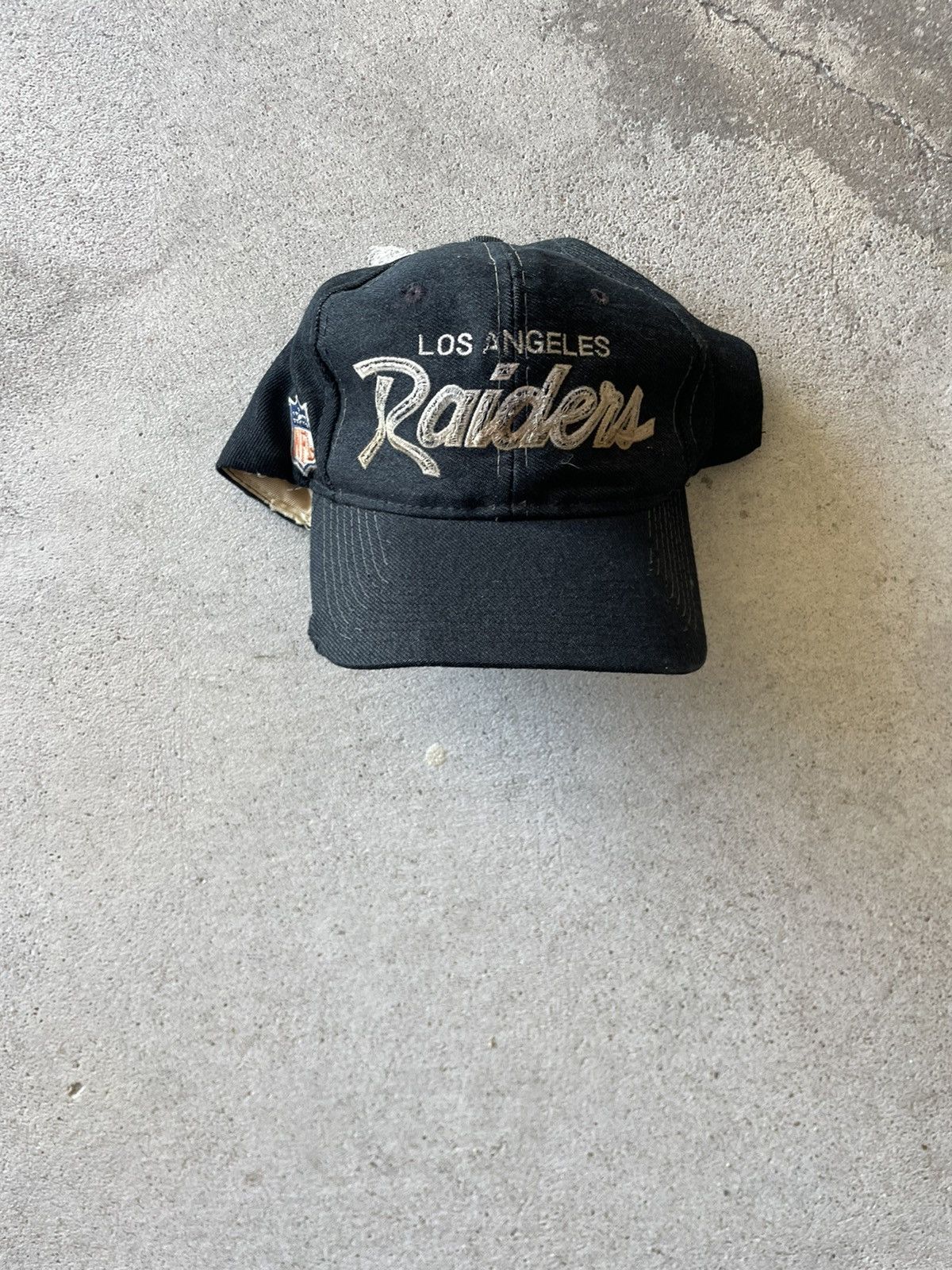 image of Sports Specialties Los Angeles Raiders Script Hat in Black, Men's