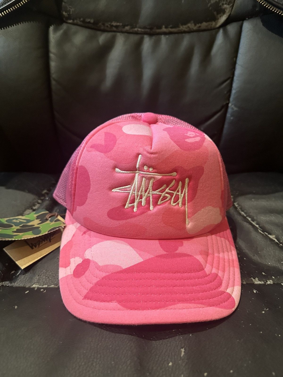image of Bape x Stussy Mesh Trucker Hat Pink Camo, Men's