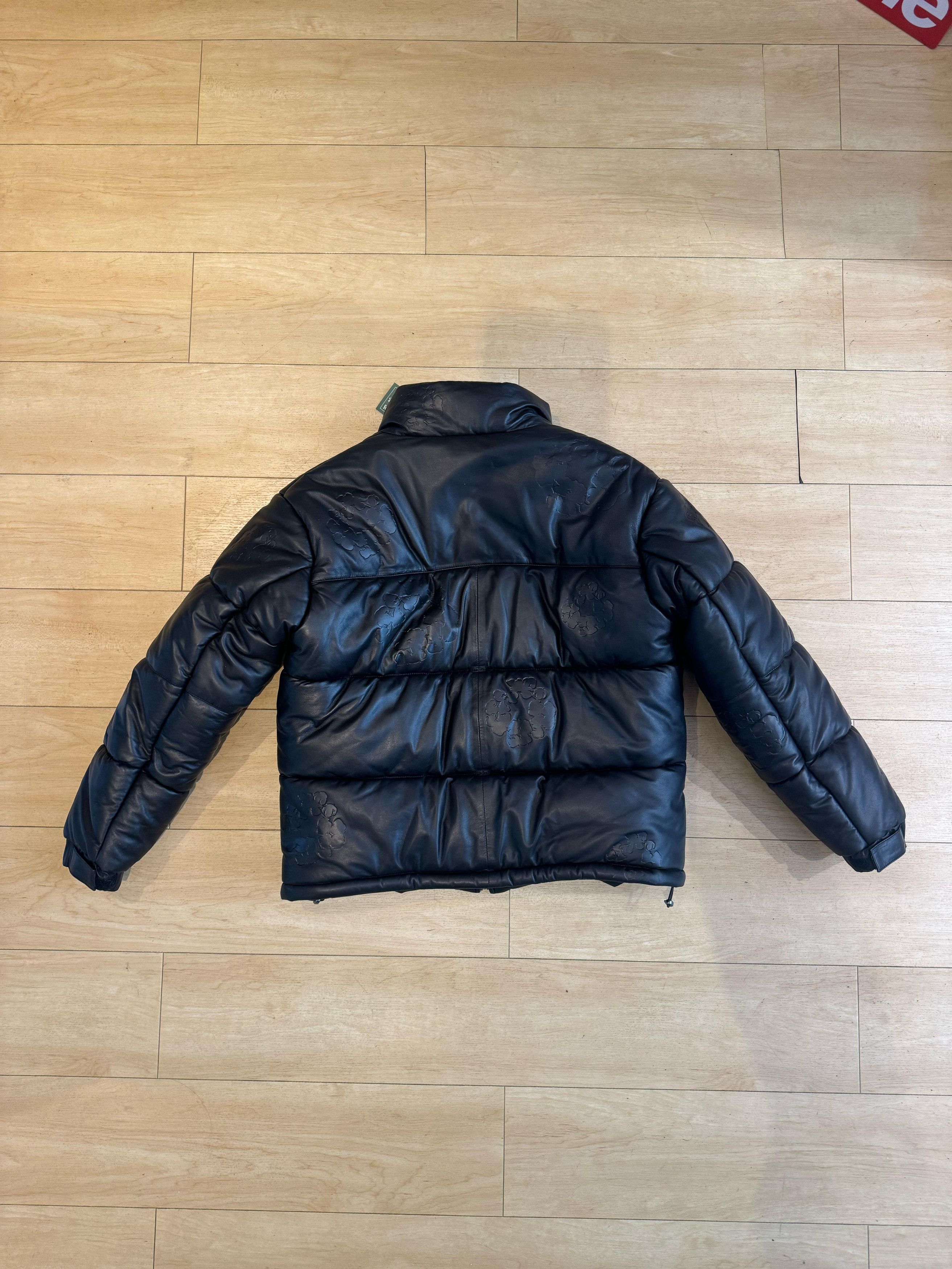 DENIM TEARS Denim Tears Leather Embossed Wreath Puffer Jacket