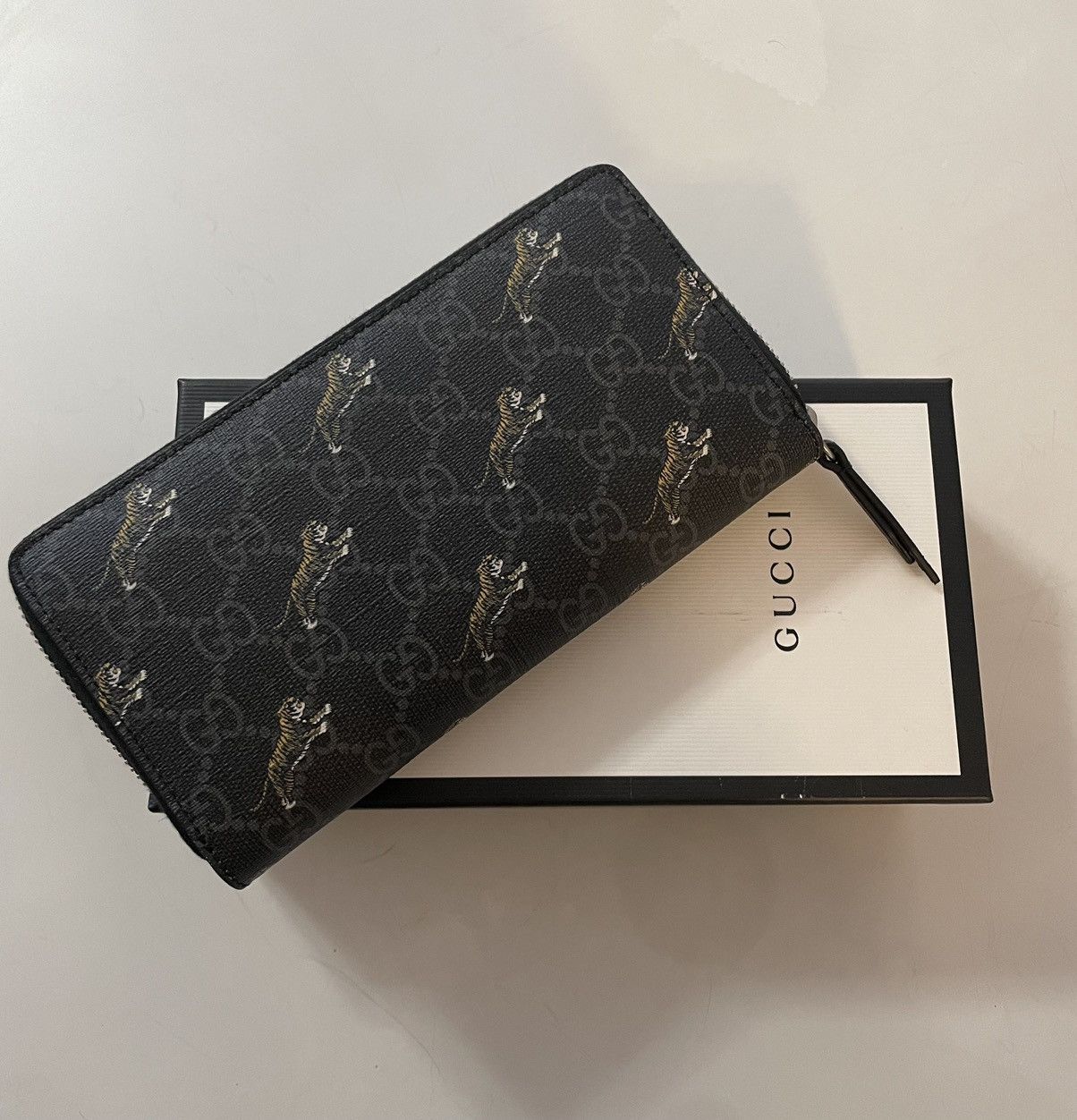 image of Gucci GG Zip Around Wallet With Tiger Print in Black, Men's