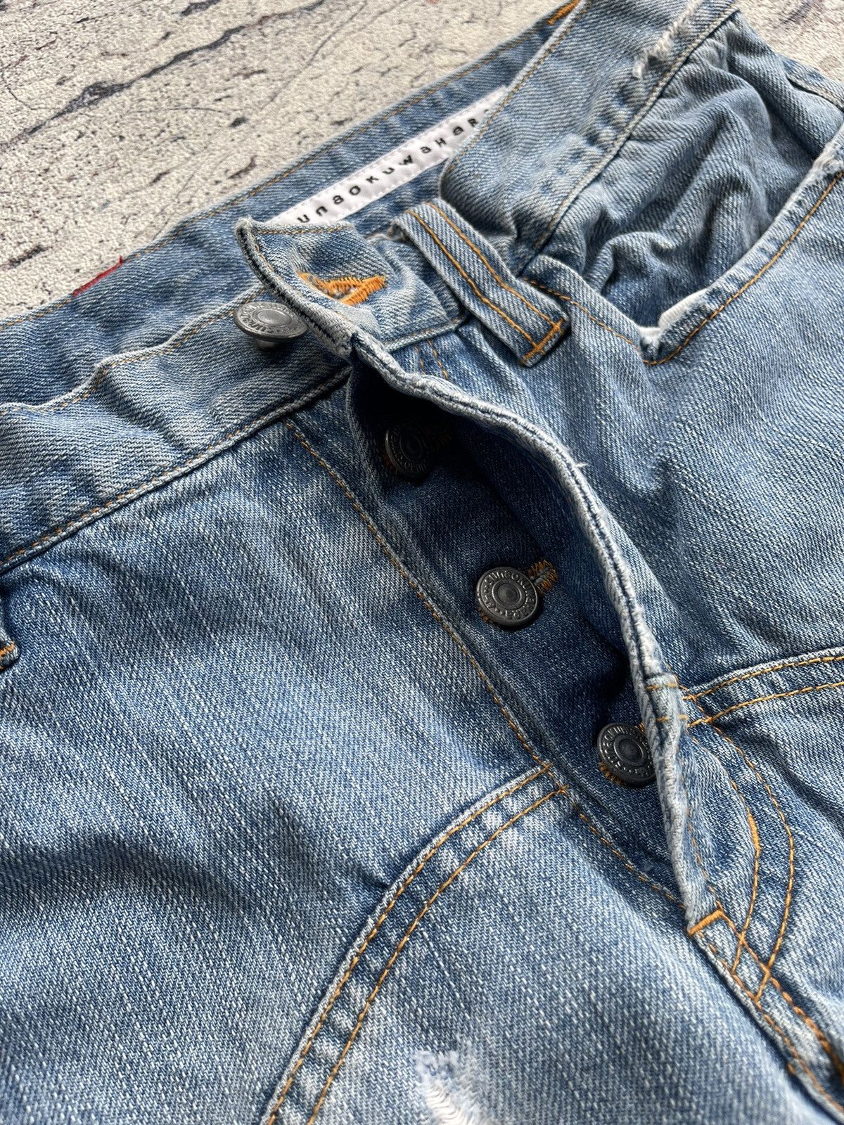 Sunao kuwahara distressed jeans by issey miyake