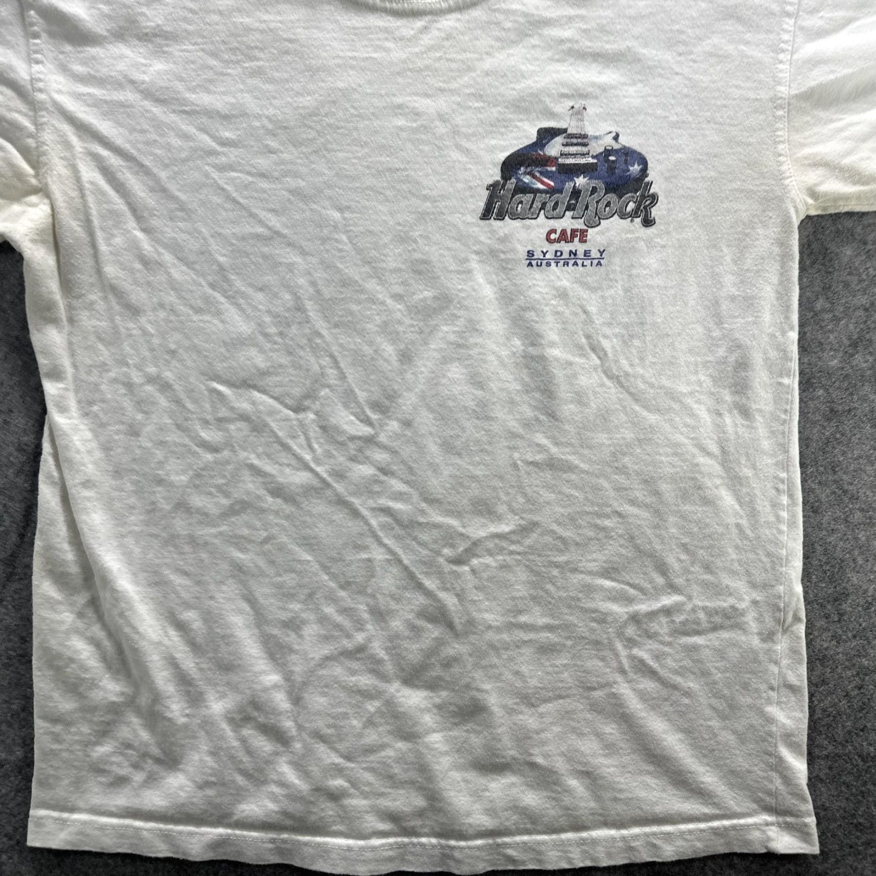 Hard Rock Cafe VINTAGE Hard Rock Cafe Shirt Mens Small White Sydney Australia 90s Guitar Rock Music Graphic Print Crew Neck Short Sleeve Cotton T-Shirt Size US S / EU 44-46 / 1 - 4 Thumbnail