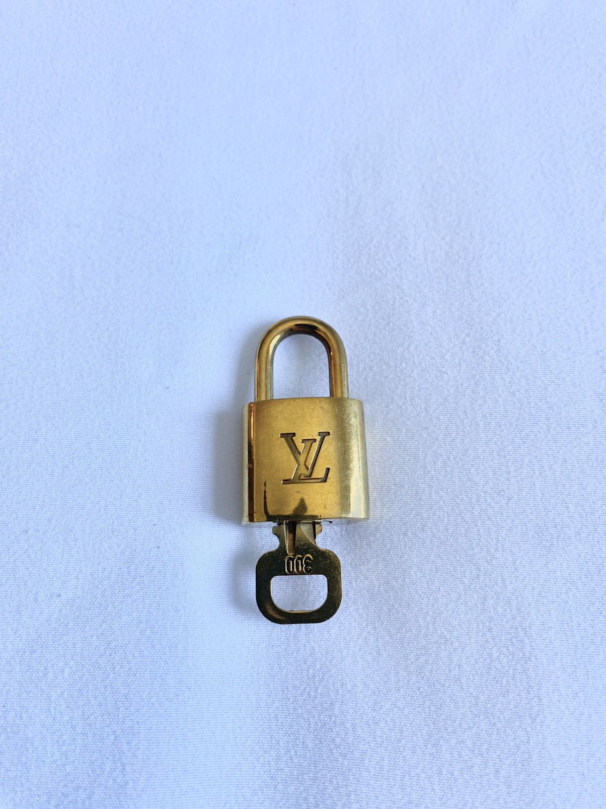 Louis Vuitton, Accessories, Authentic Louis Vuitton Lv Set Padlock Key  Bag Charm Cadena Gold Plated