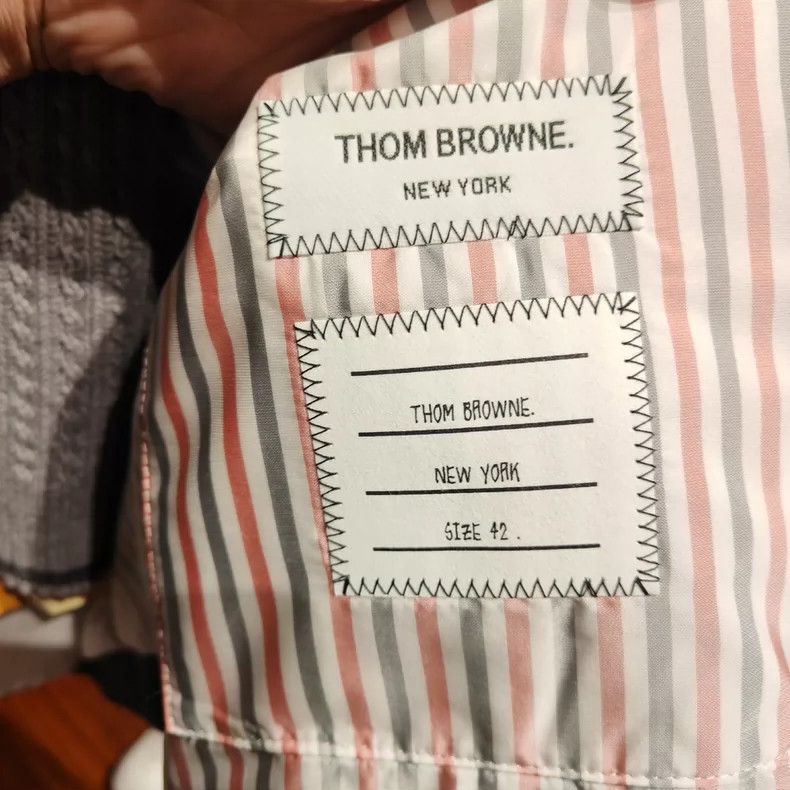 Thom Browne A striped down jacket with a hat