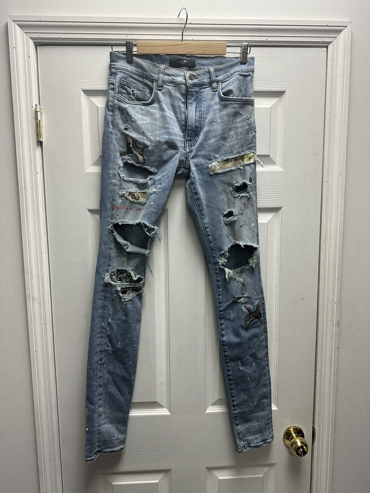 Amiri Thrasher crane patches paint splatter jeans