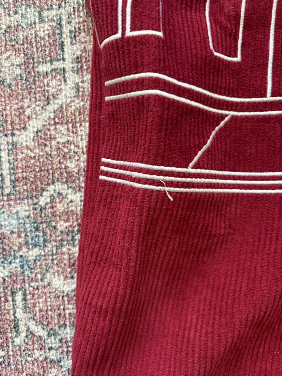 comedie de KidSuper Red Embroidered cotton trousers