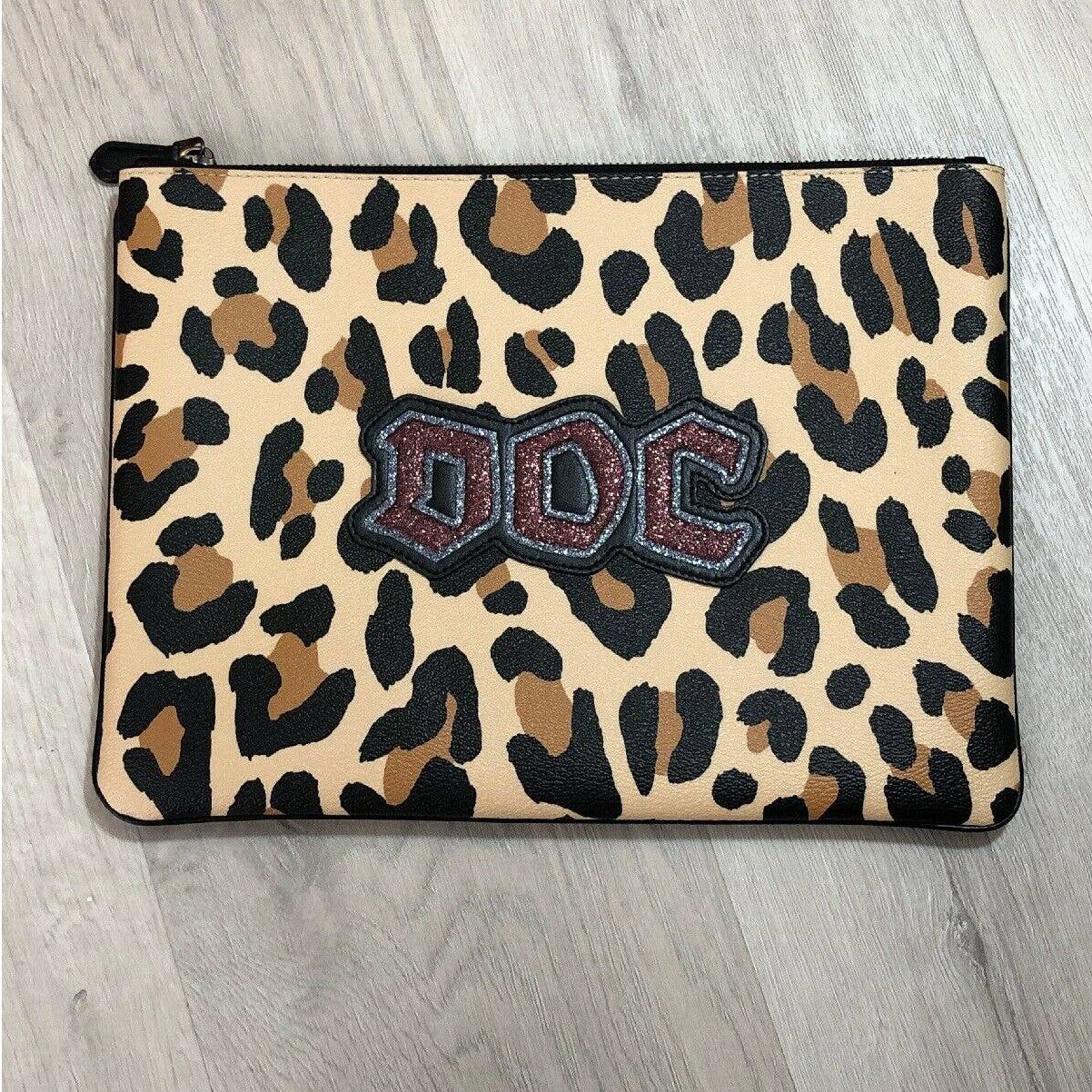 image of Disney X Coach Snow White Glitter Doc Large Clutch Pouch in Brown, Men's