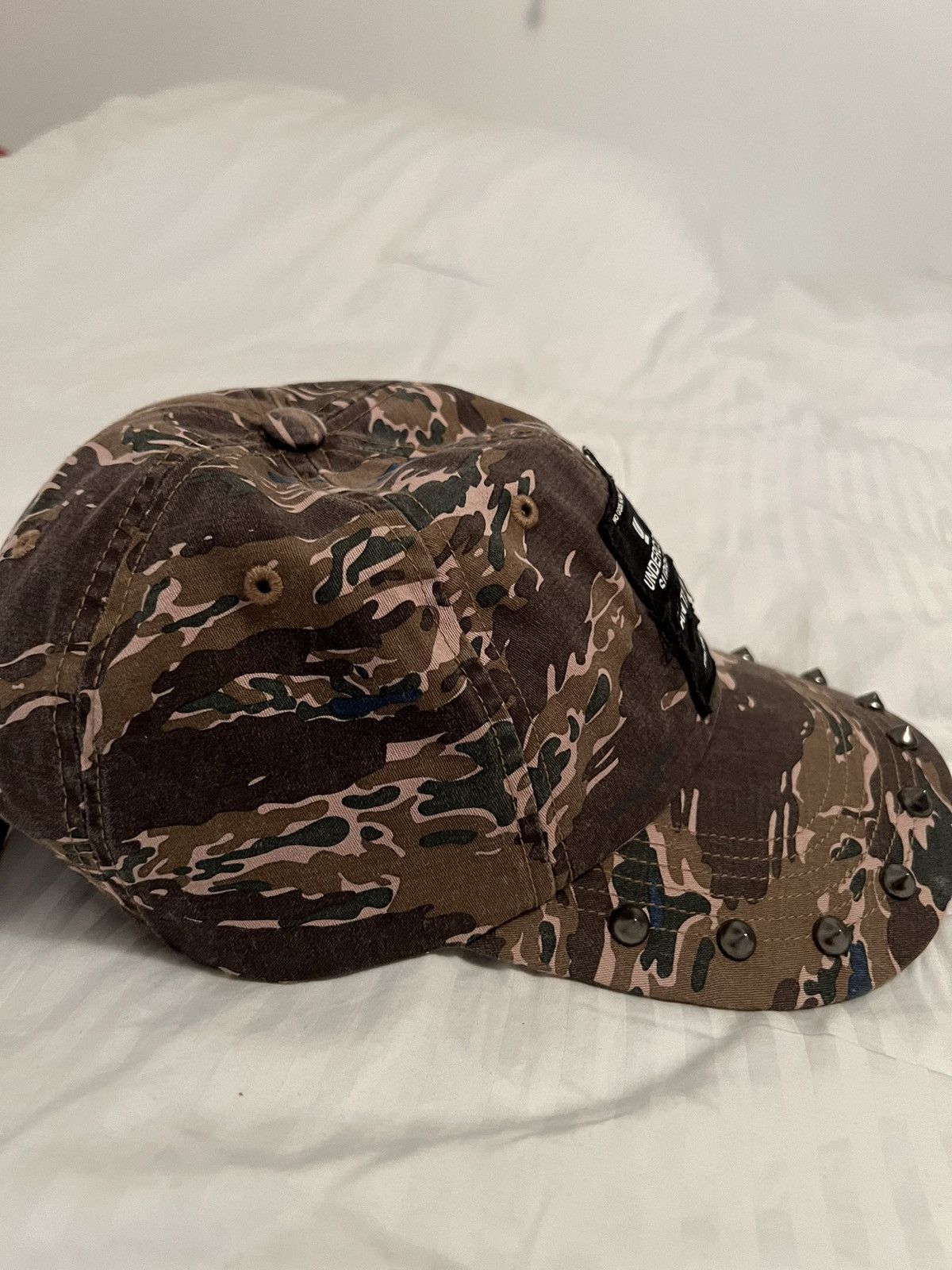 UNDERCOVER × SUPREME Stupped 6-Panel Supreme UNDERCOVER Studded 6-Panel (SS23) - $58