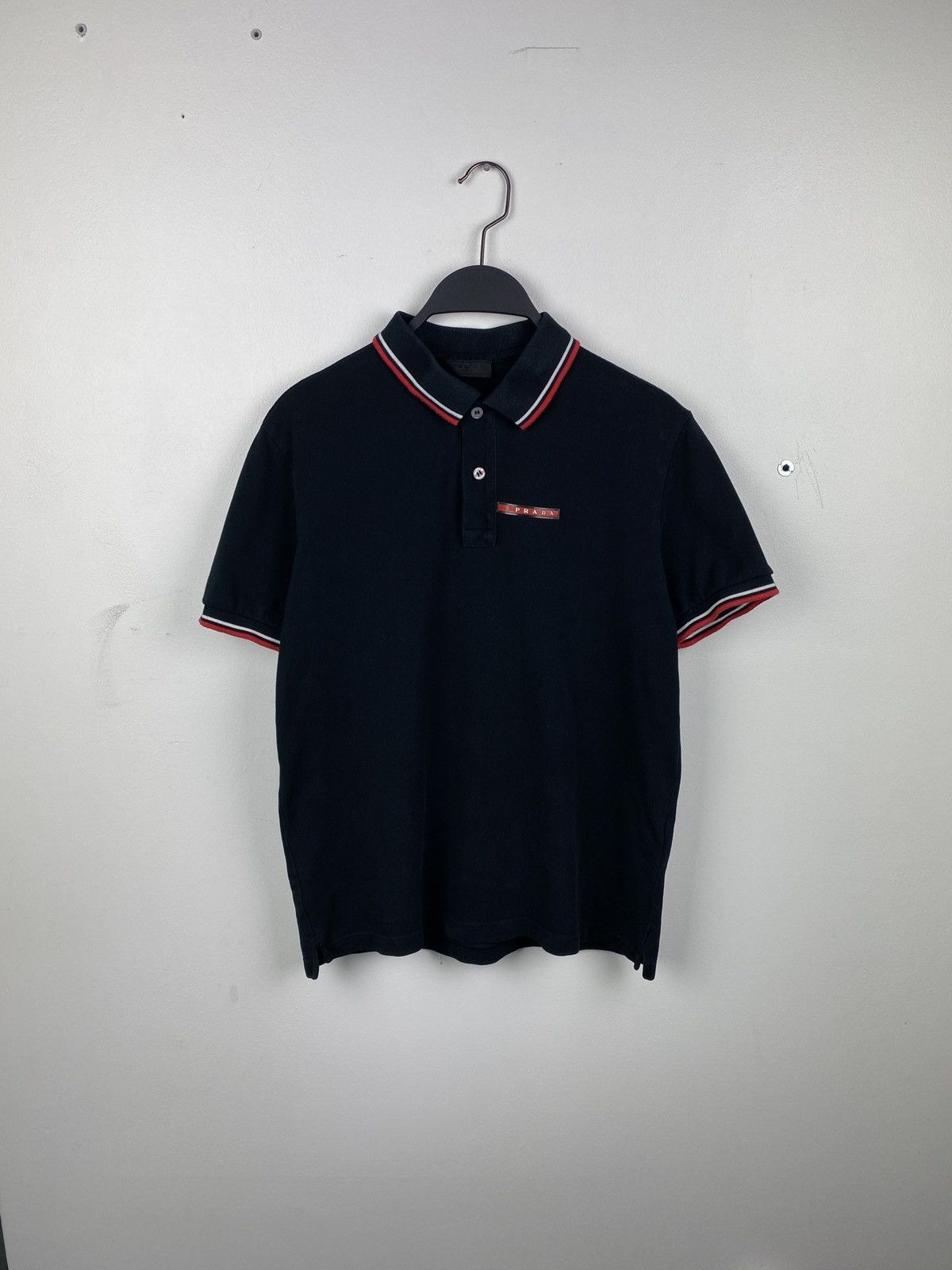 image of Italian Designers x Prada Milano Polo Red Tab Logo Tshirt in Black, Men's (Size Medium)