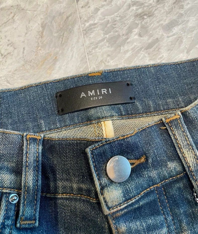 Amiri yellow mud washed blue jeans