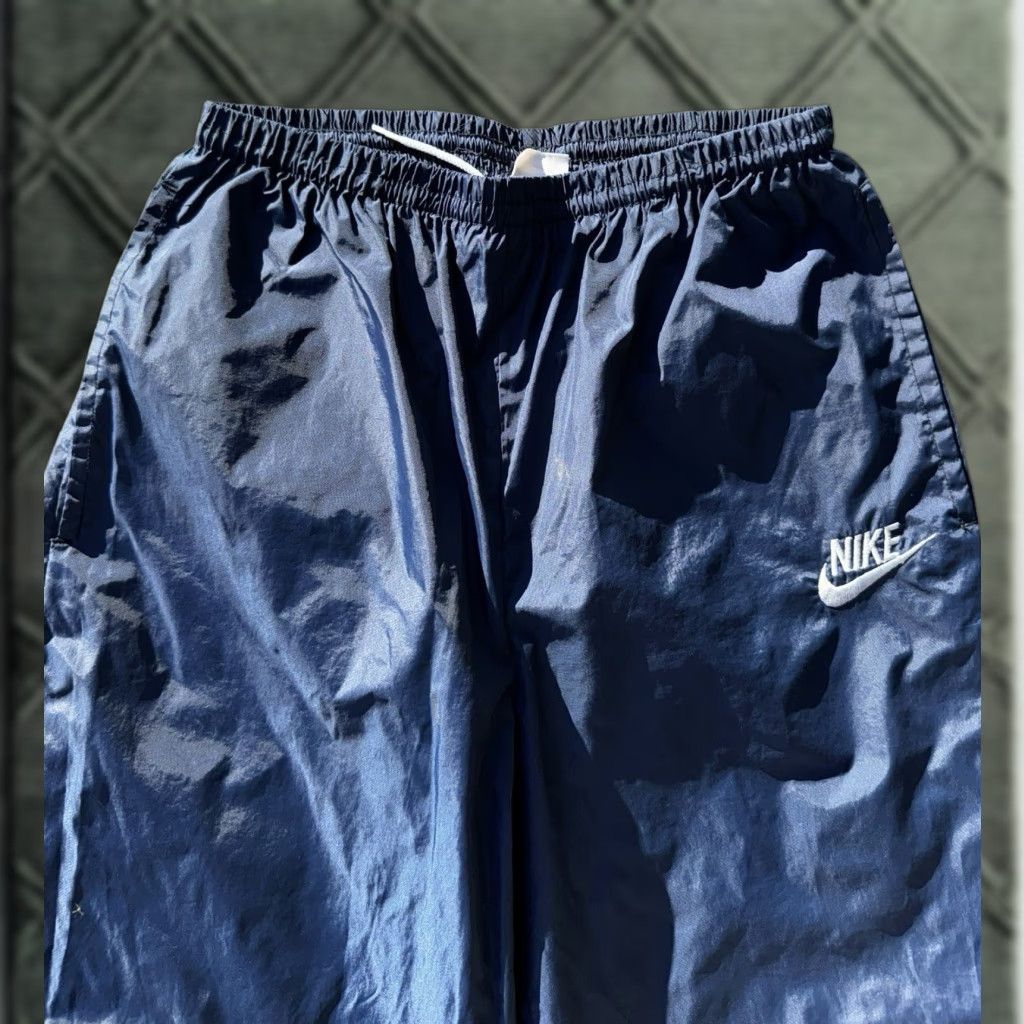 Nike VINTAGE Nike 80s Blue Nylon Embroidered Logo Baggy Wide Leg Track Pants Sz M Mens Regular Blue 80s Nike Logo Track Pants Wide-Leg Nylon Men M Size US 31 - 1 Thumbnail