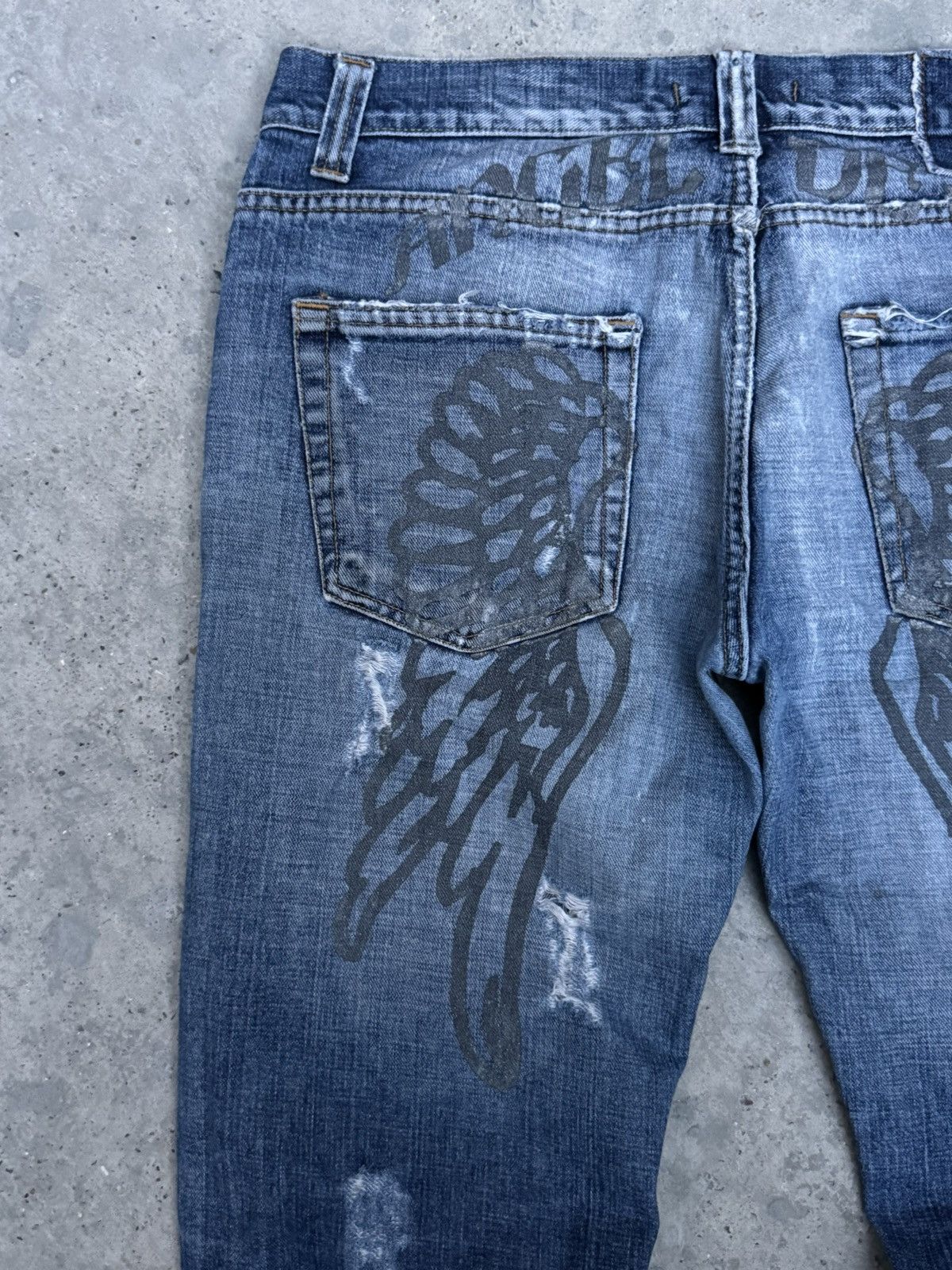 VINTAGE DISTRESSED WINGS DENIM JEANS