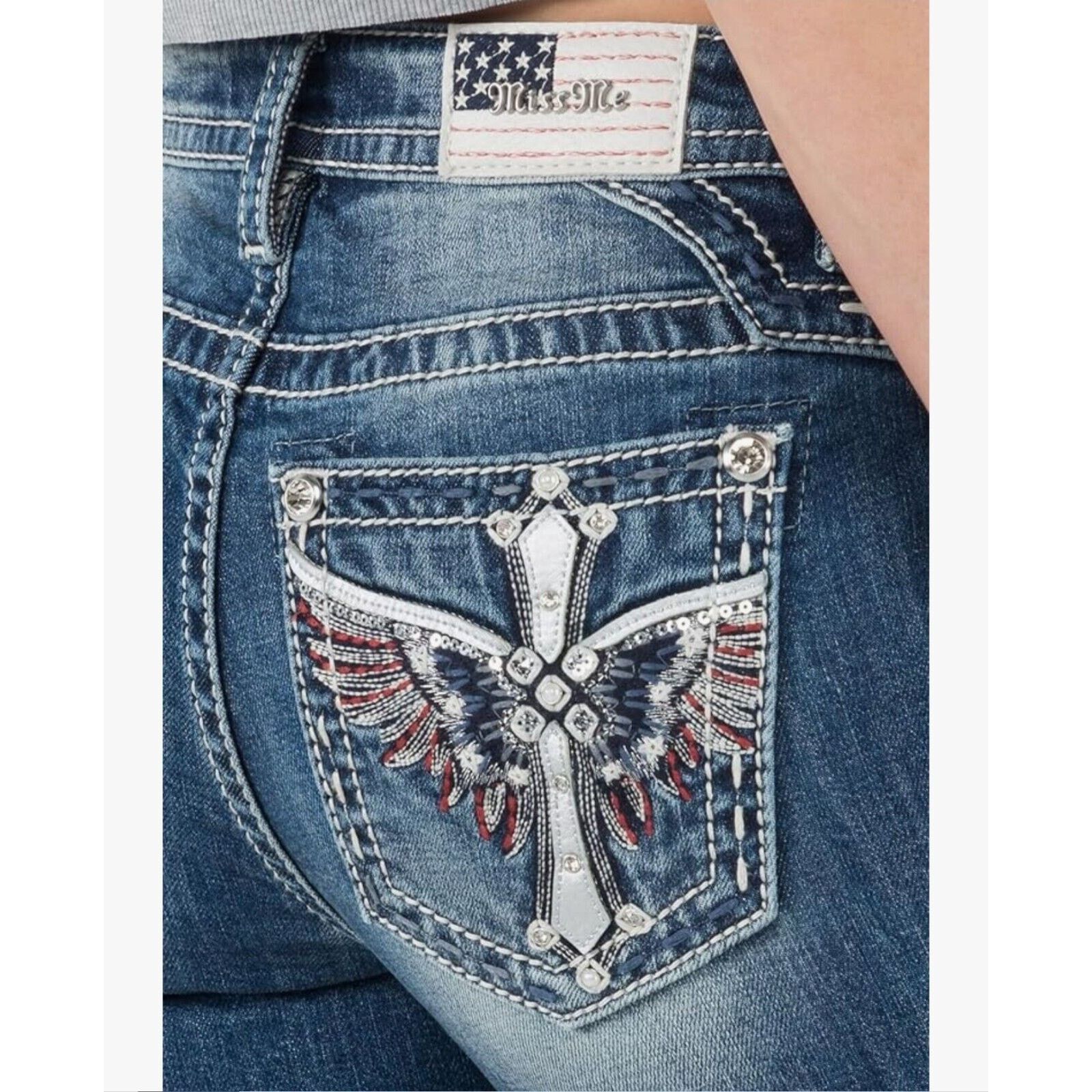 image of Miss Me American Wing Cross Rhinestone Mid-Rise Boot Cut in Blue, Women's (Size 26)