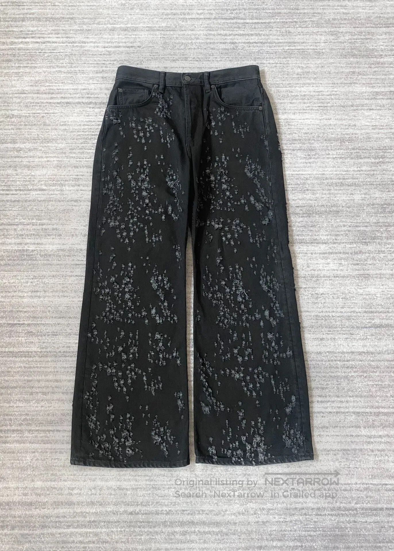 Acne Studios Distressed Black Denim Flared Pants.