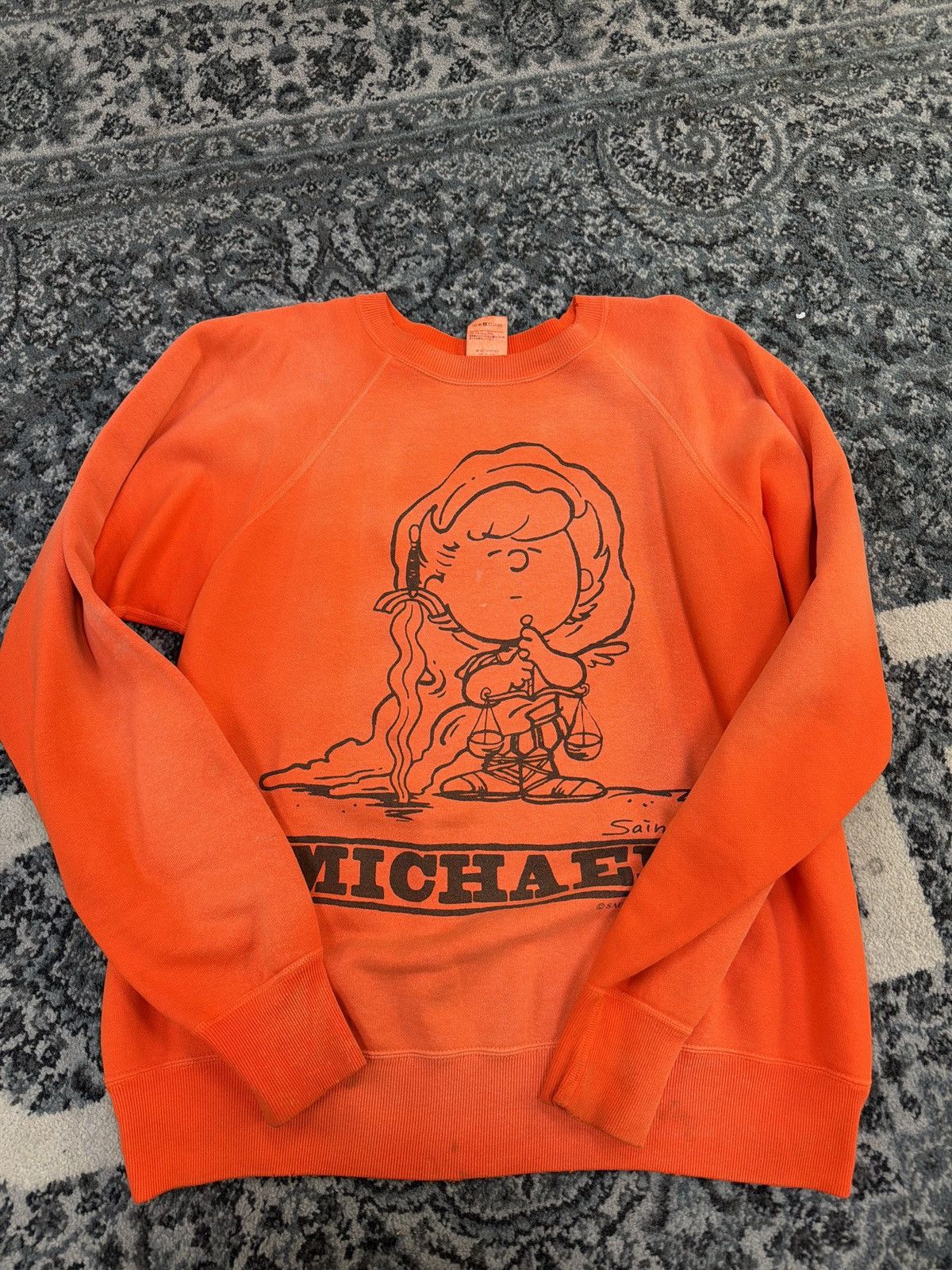 Saint Michael peanuts crewneck orange