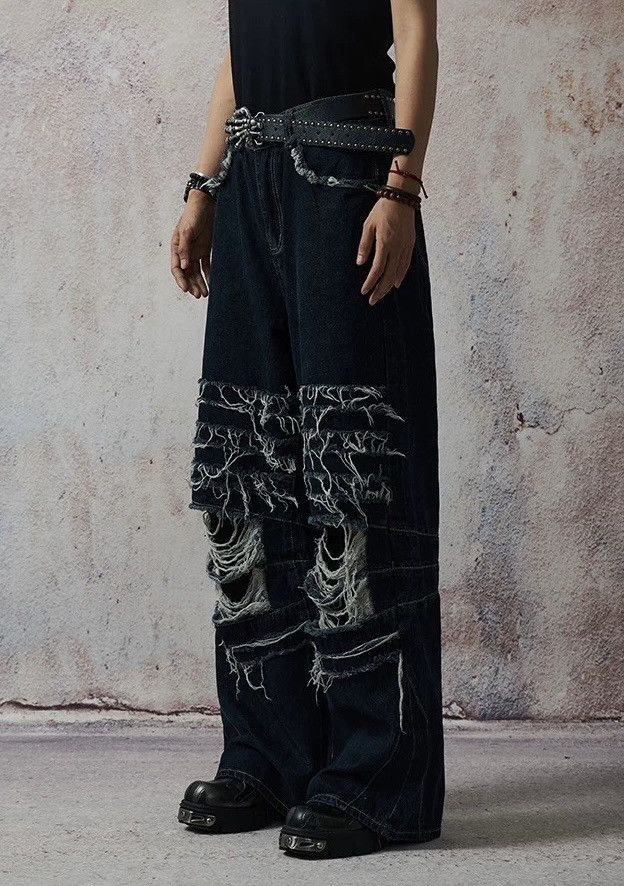 Avant garde fashion punk damage distressed ripped jeans