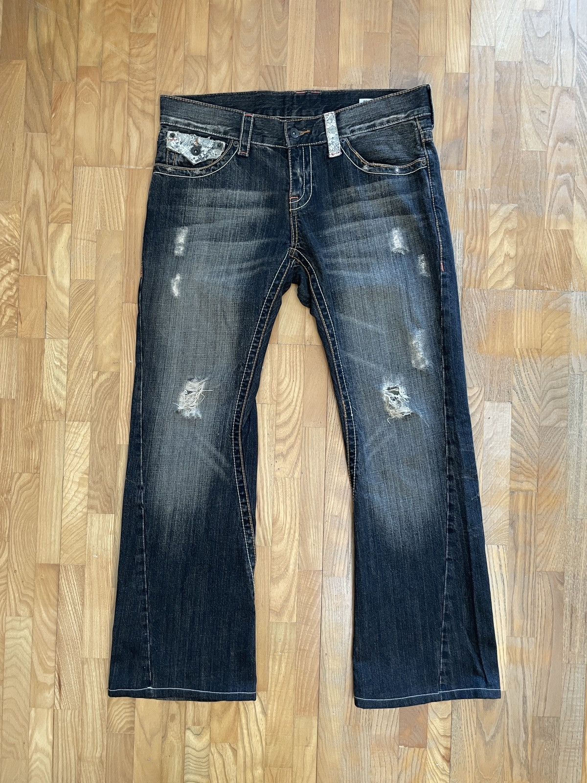 Semantic Design Distressed Boot-Cut Jeans