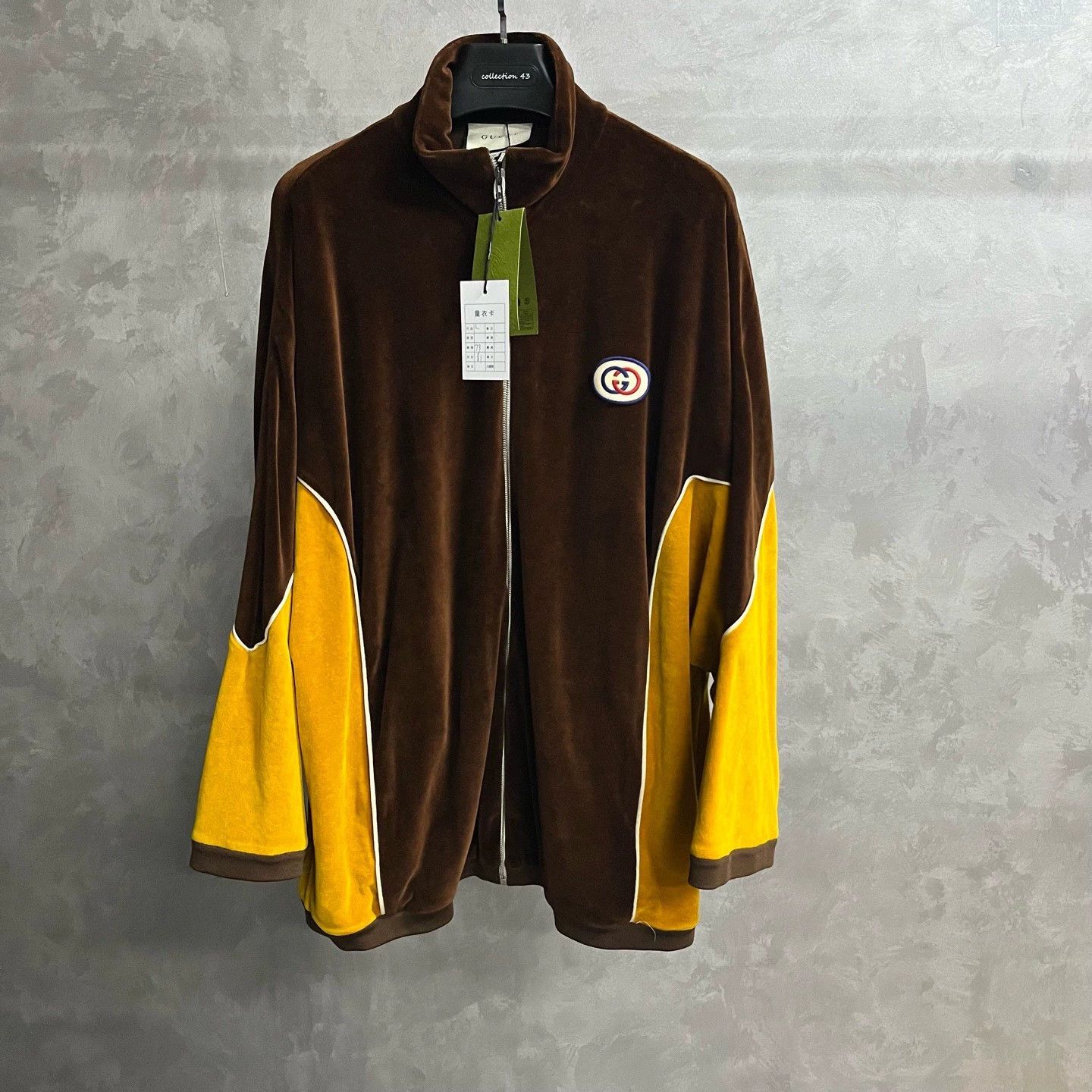 brown zip-up logo printed jacket
